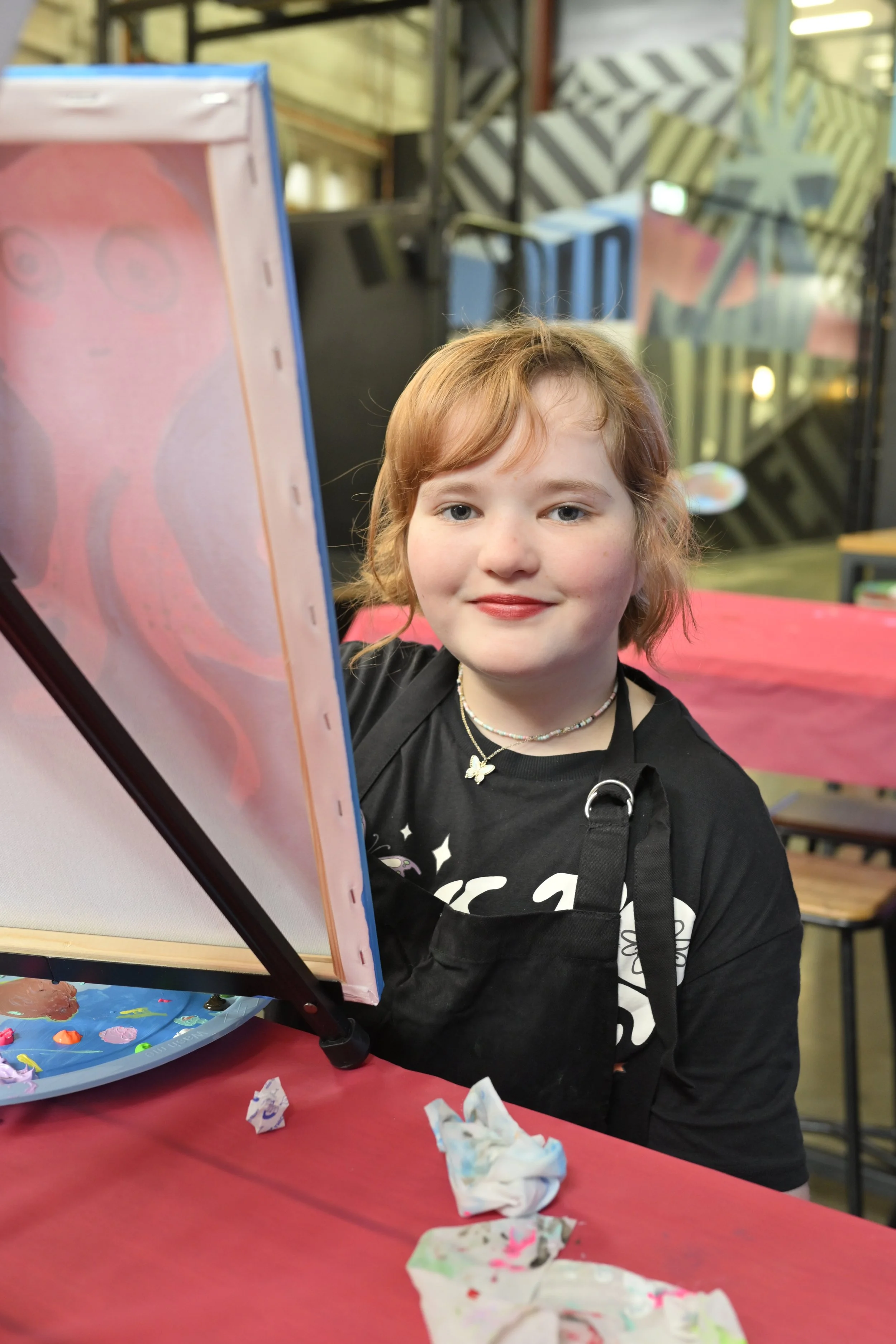 Smiling girl painting