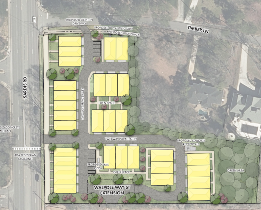 A site plan of a residential development with buildings, roads, parking, landscaped areas, and labels indicating features like mail kiosk, open spaces, pedestrian crossings, and proposed structures.