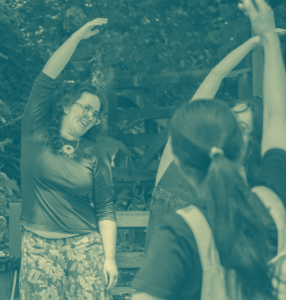 A blue and yellow photograph of people stretching in a woodland