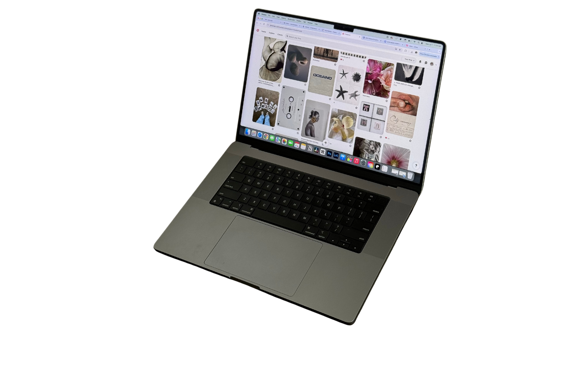 A silver laptop with a black keyboard displaying a Pinterest page filled with images of flowers, art, and nature.