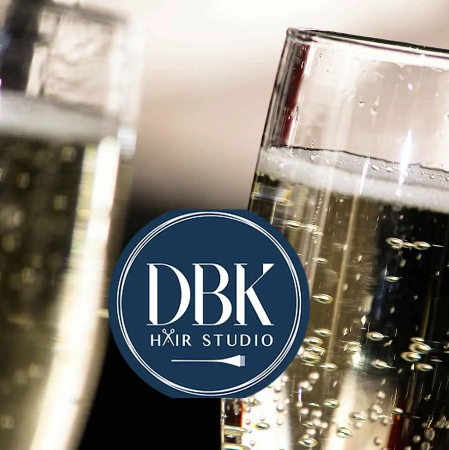 DBK logo and glasses with bubbling champagne