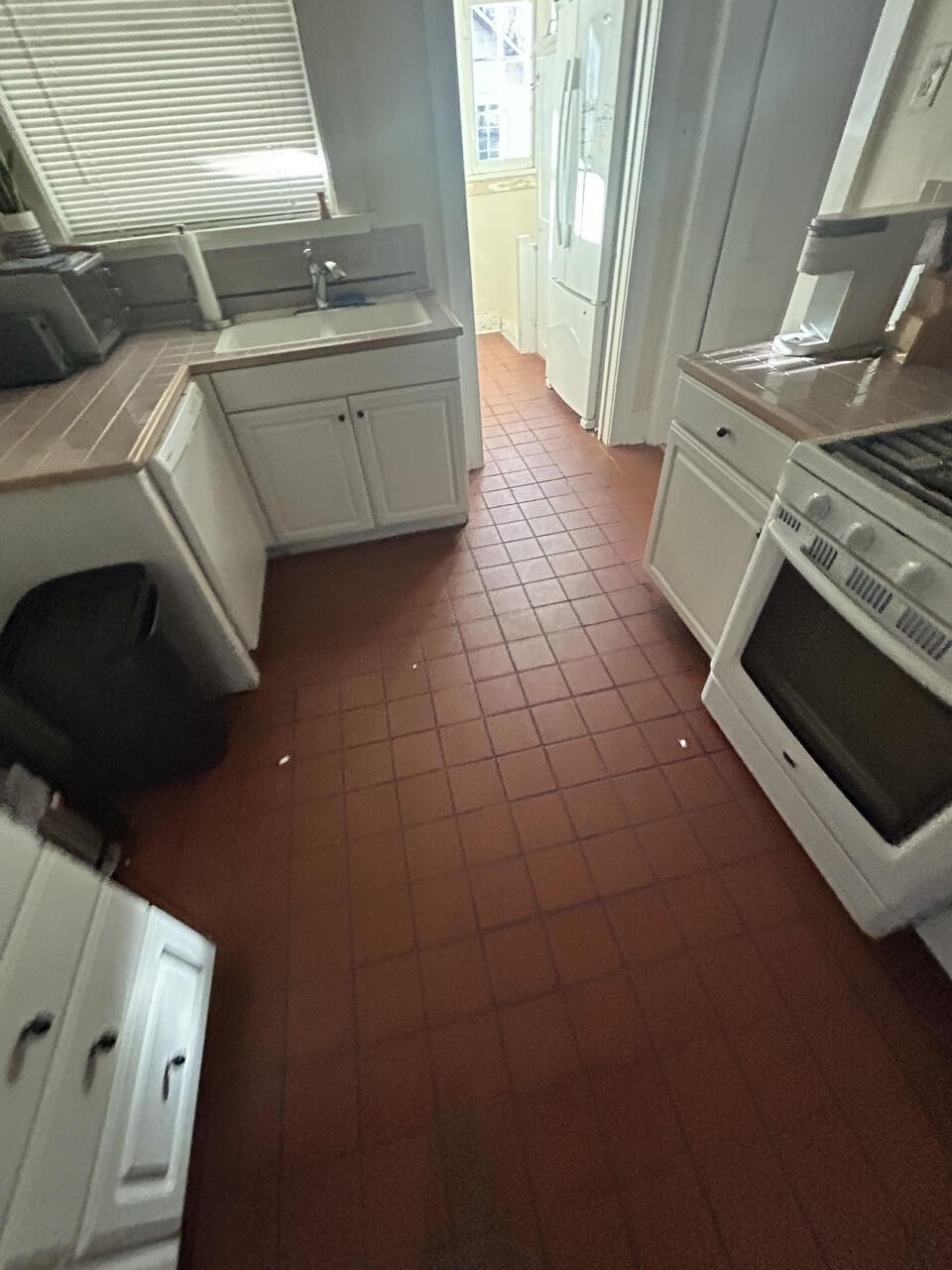 BEFORE: Replace kitchen tile flooring