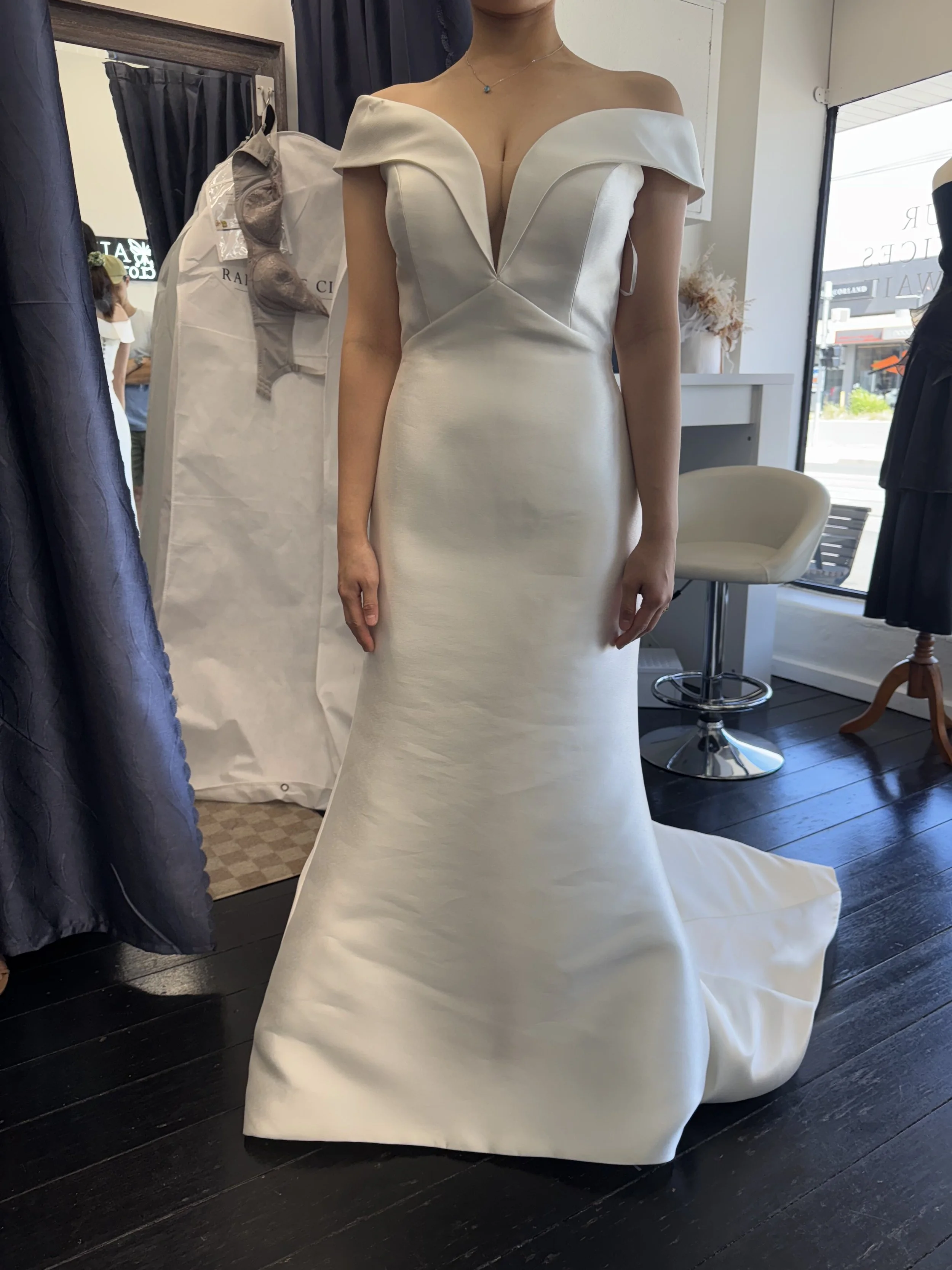 Bride with altered dress posing for the camera