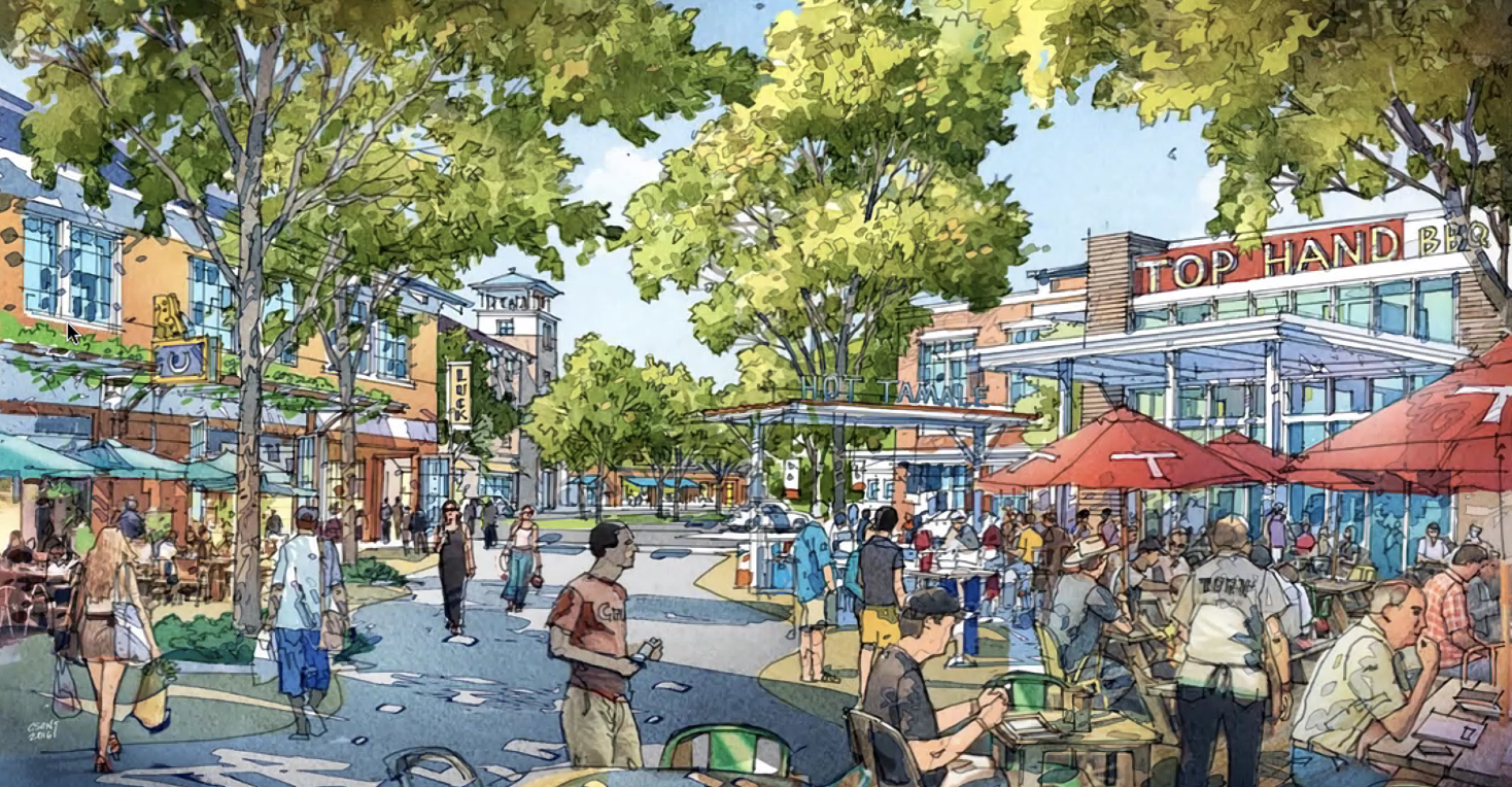 A lively street scene with people dining outdoors under red umbrellas, pedestrians walking, trees lining the street, and shops including a hotel, a beverage shop, and a restaurant.