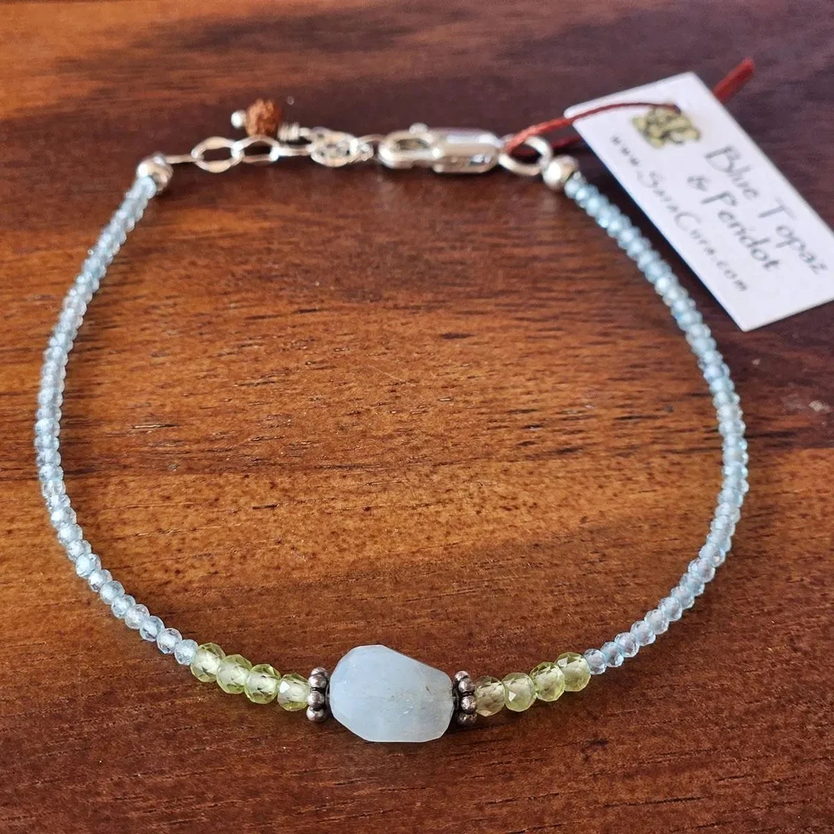 Blue-Topaz-Peridot-Adjustable-Bracelet-with-Aquamarine-Center-Stone-1.jpg