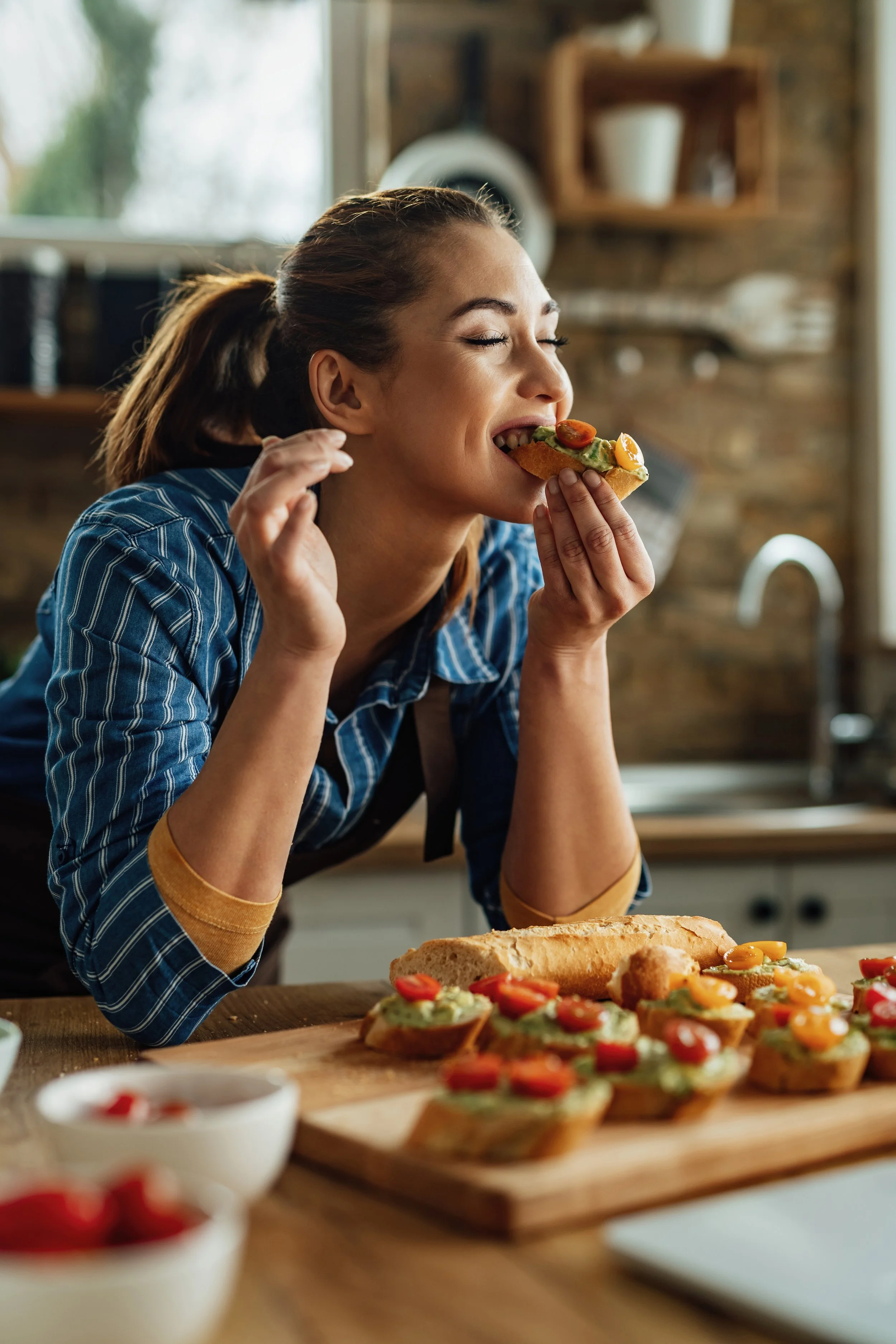 Lady enjoying avocado on bread