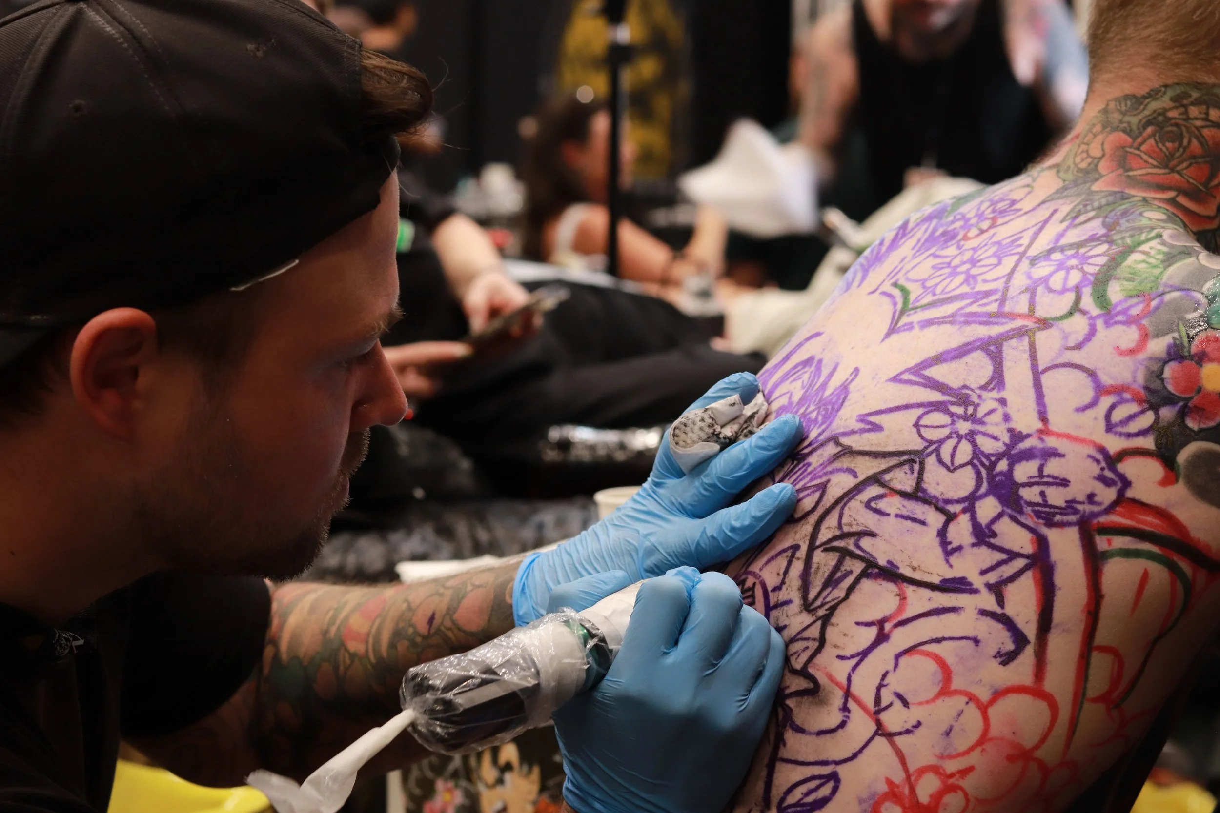 Nicklas Wong, tattoo artist based in Northcote, Melbourne, working on a large backpiece