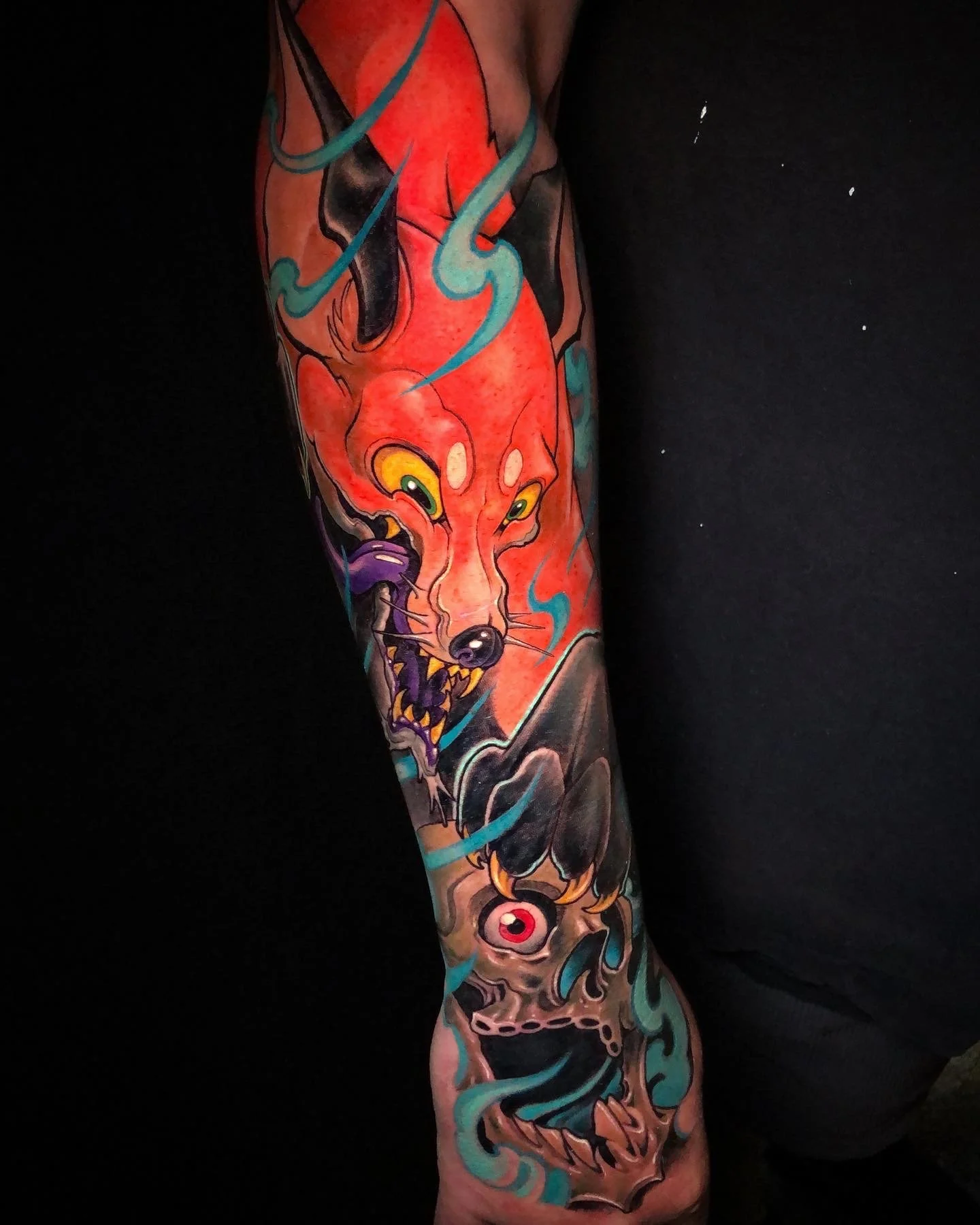 Red fox sleeve detail with flowing blue shapes by Nicklas Wong, tattoo artist in Northcote, Melbourne