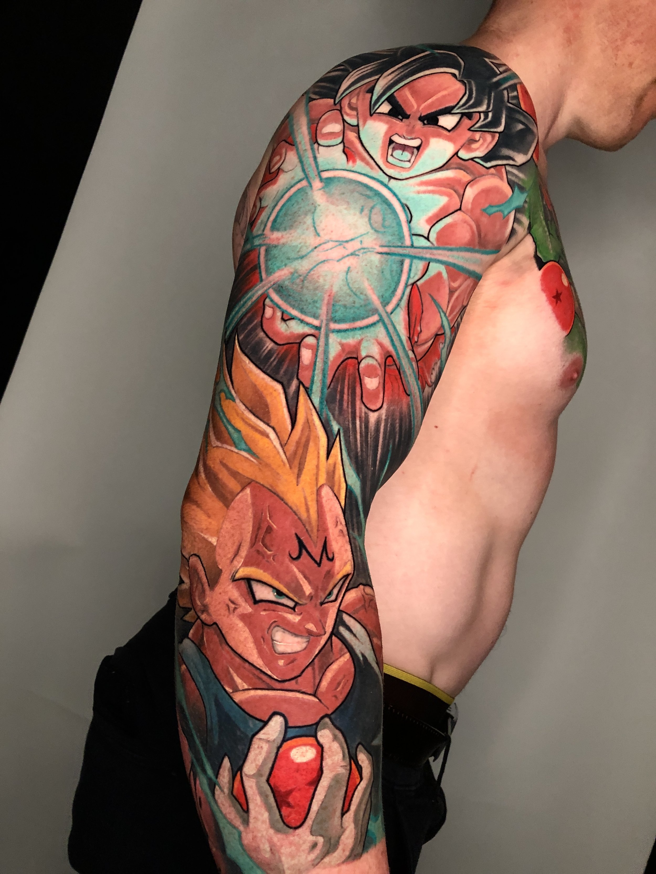 Dragon Ball sleeve with Goku, Majin Vegeta and a glowing energy blast by Nicklas Wong, tattoo artist in Northcote, Melbourne