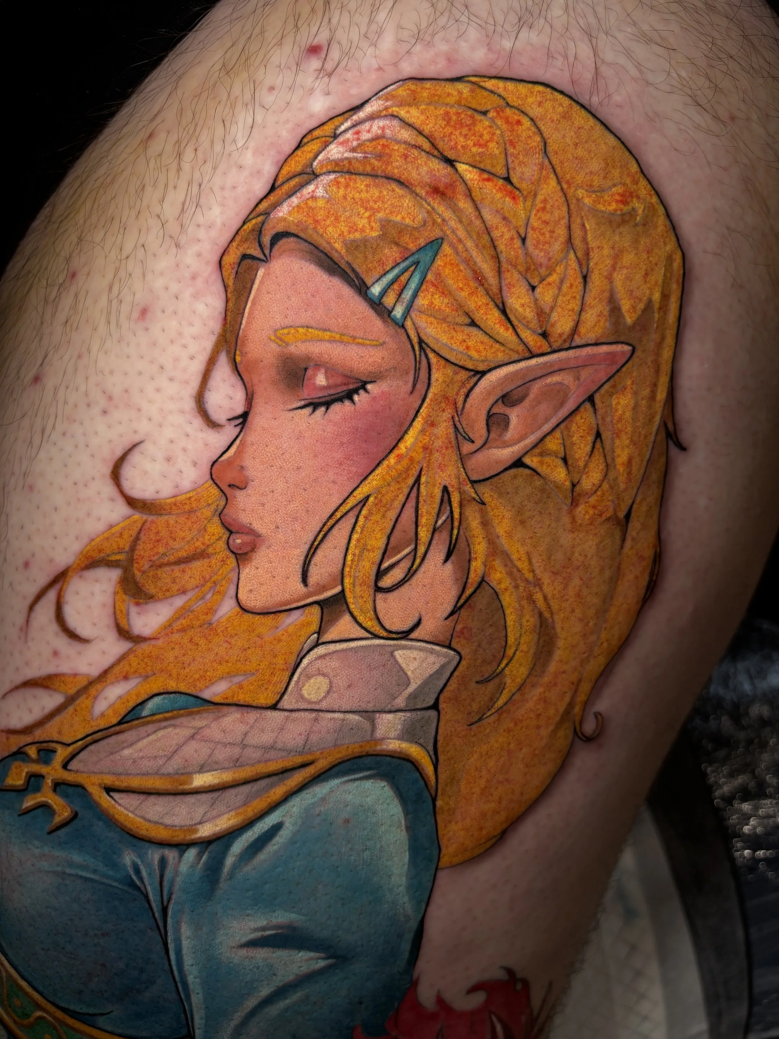 Princess Zelda portrait tattoo with golden hair and blue clothing by Nicklas Wong, tattoo artist in Northcote, Melbourne