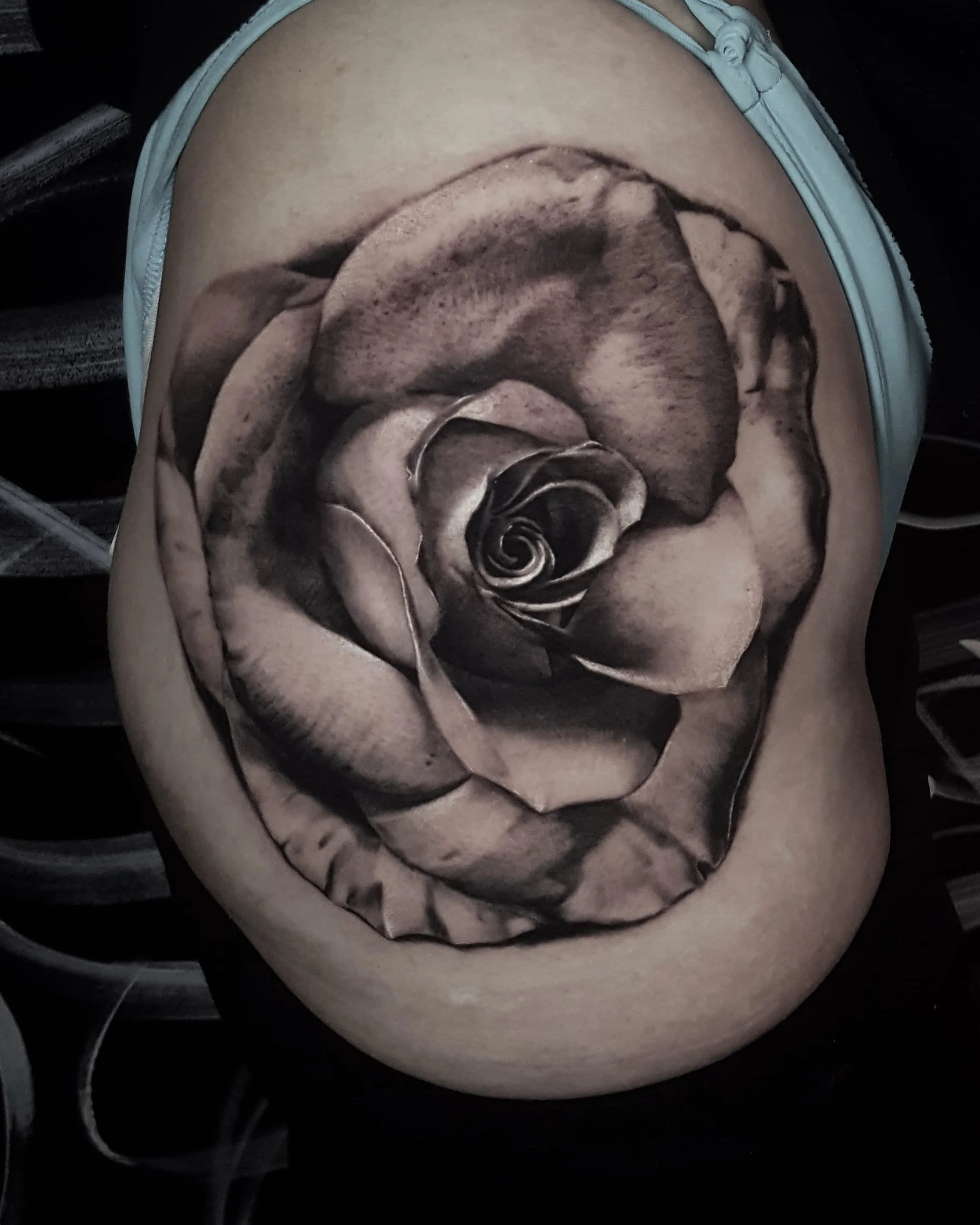 Realistic black and grey rose tattoo on the shoulder by Nicklas Wong, tattoo artist in Northcote, Melbourne