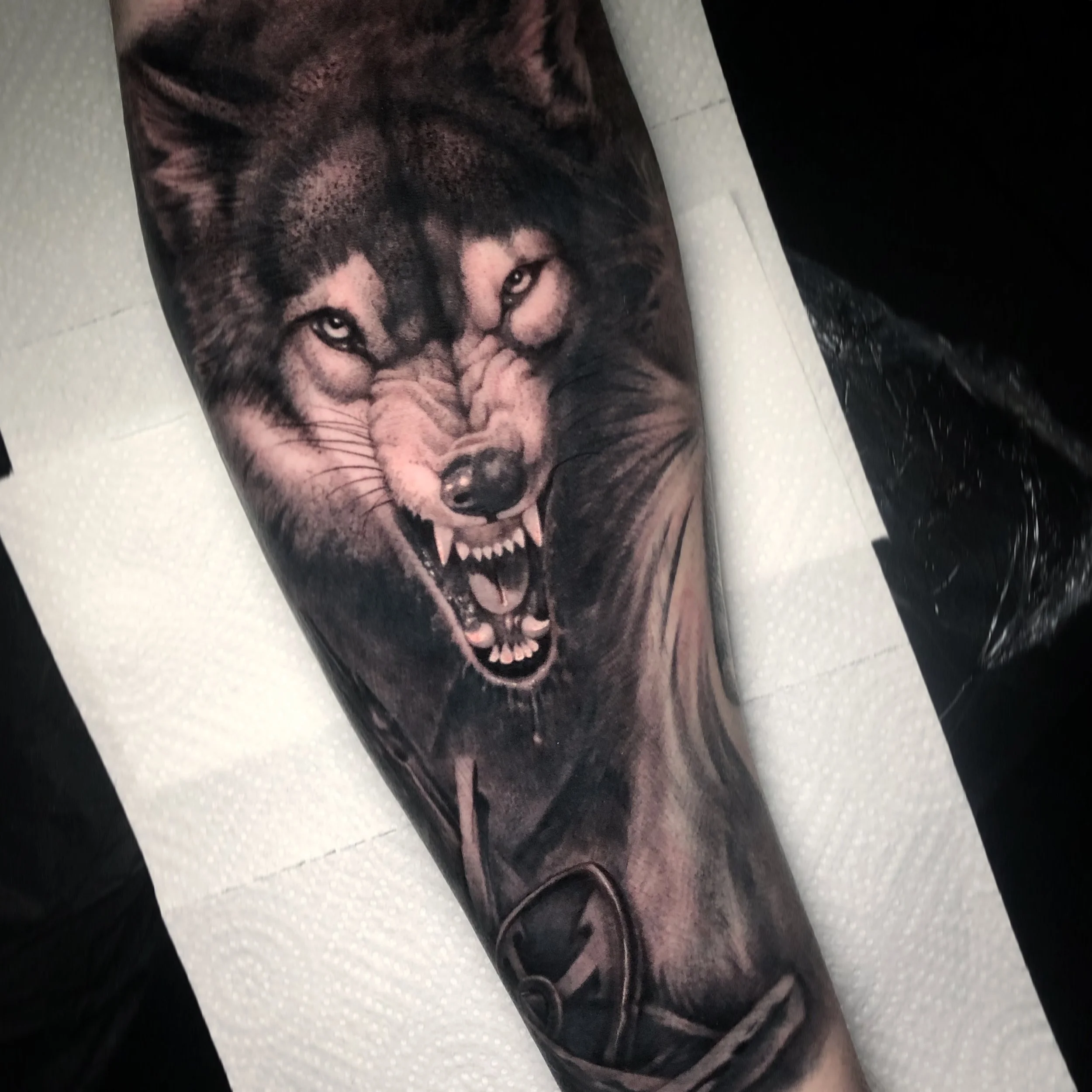 Black and grey screaming face tattoo by Nicklas Wong, tattoo artist in Northcote, Melbourne