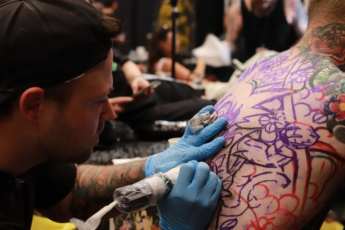 Nicklas Wong, tattoo artist based in Northcote, Melbourne, working on a large Japanese-inspired backpiece