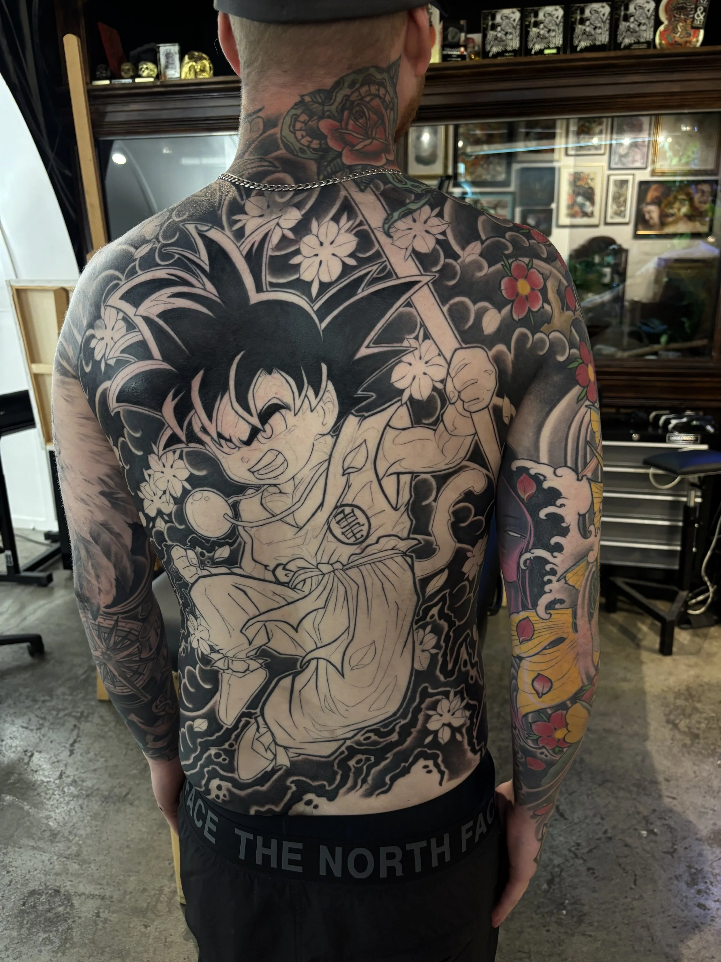 Goku backpiece in progress with Japanese-inspired clouds and flowers by Nicklas Wong, tattoo artist in Northcote, Melbourne
