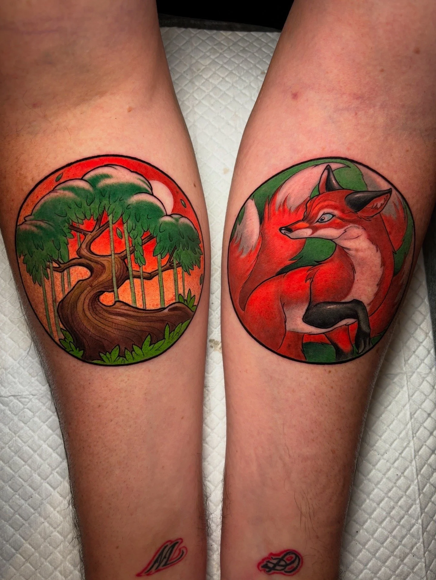 Pair of circular forest and fox tattoos by Nicklas Wong, tattoo artist in Northcote, Melbourne