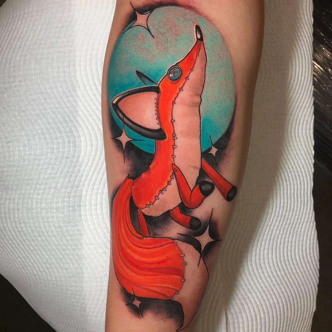Red fox tattoo with a turquoise circular background by Nicklas Wong, tattoo artist in Northcote, Melbourne