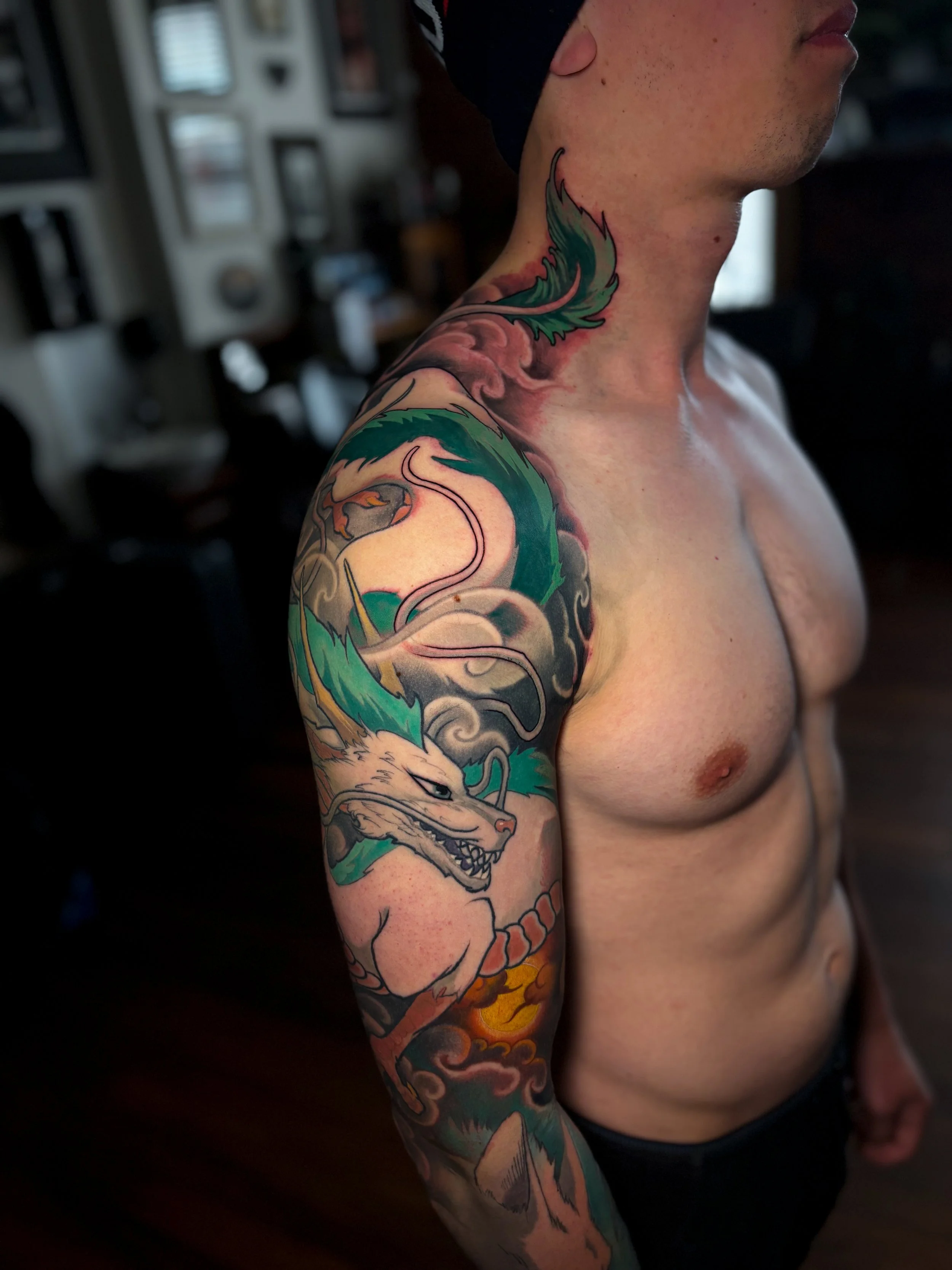 Colour fantasy sleeve with Japanese-inspired waves and clouds by Nicklas Wong, tattoo artist in Northcote, Melbourne