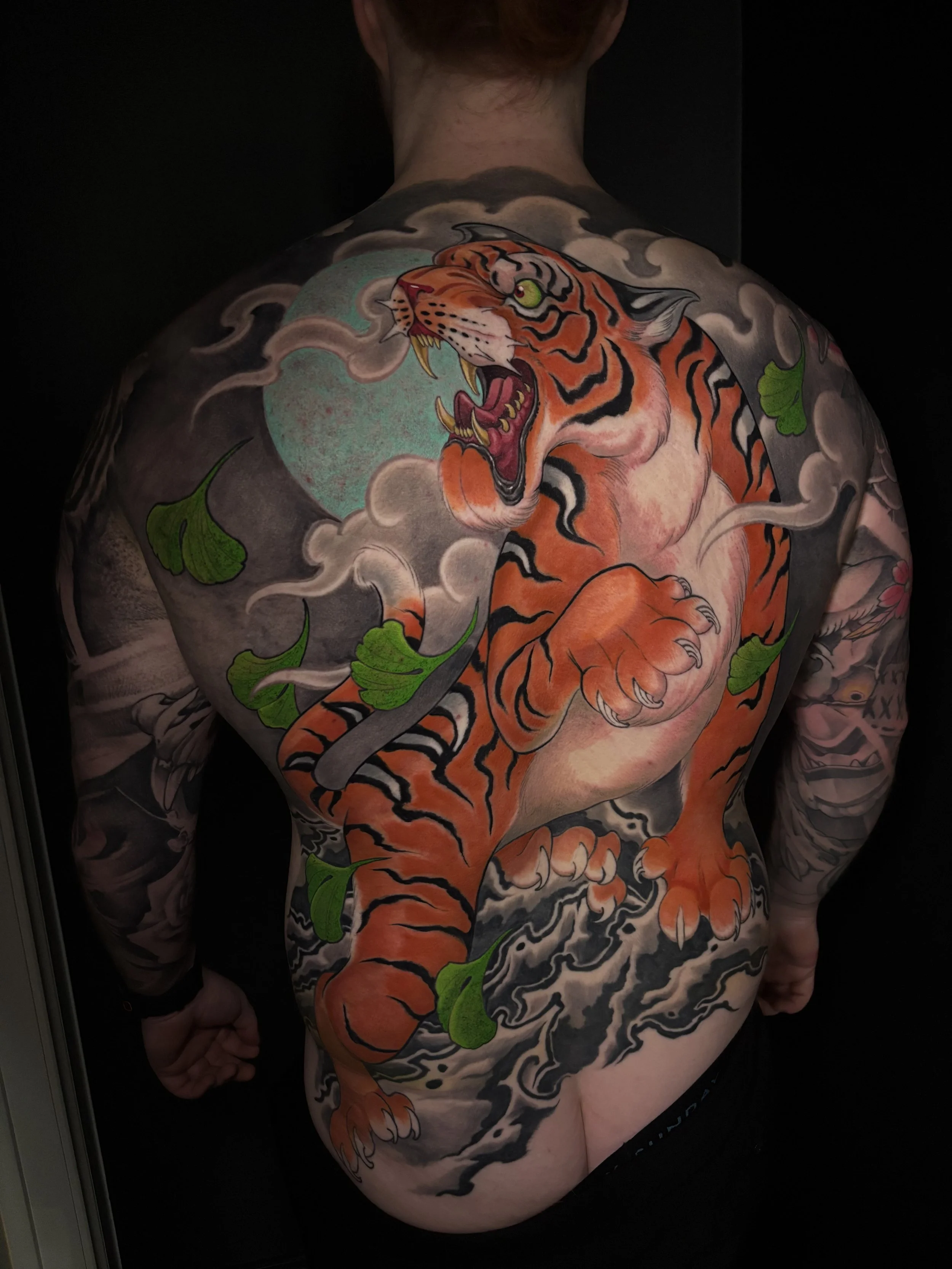 Neo-Japanese tiger backpiece with bamboo and swirling clouds by Nicklas Wong, tattoo artist in Northcote, Melbourne