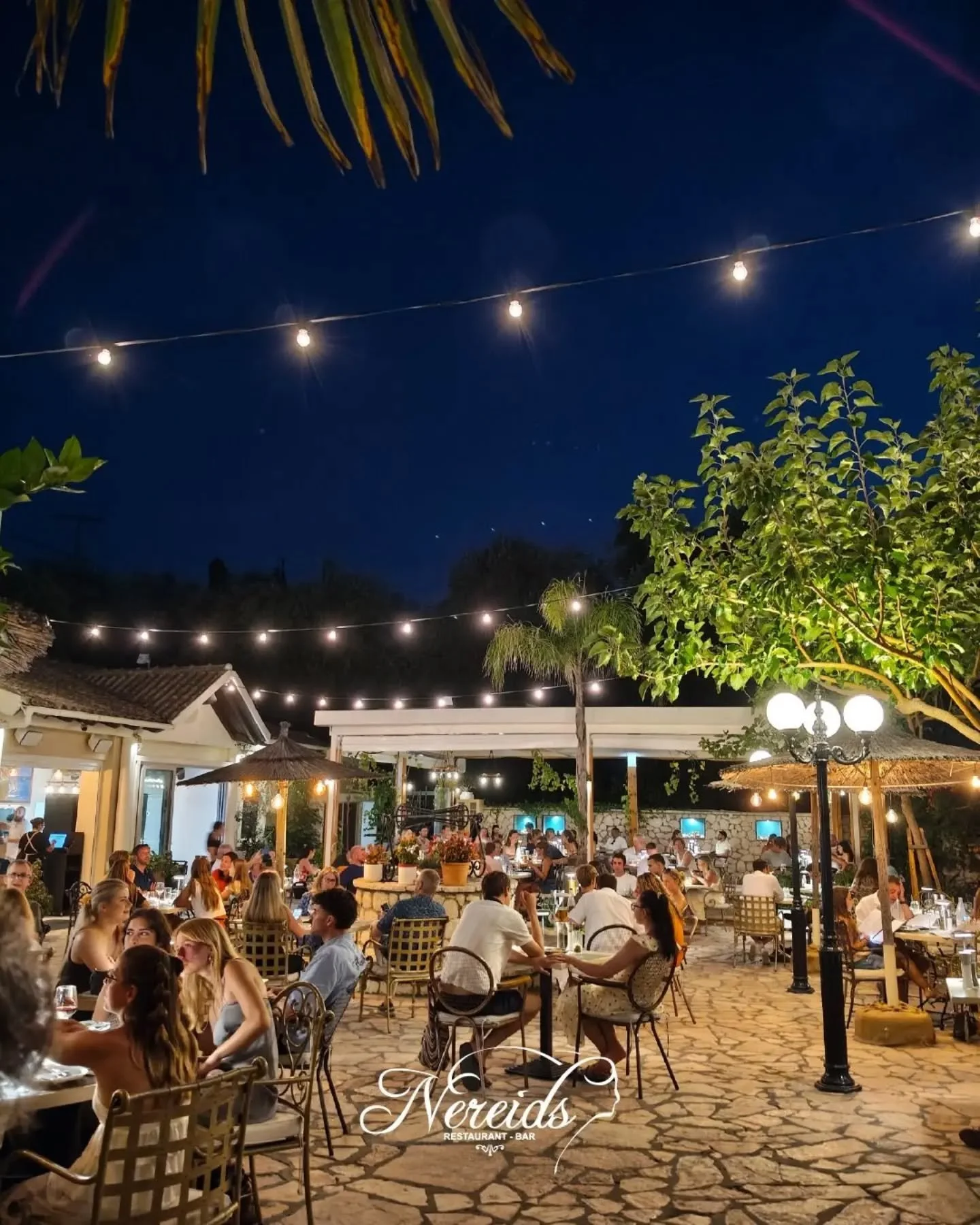 🌙 Evenings like this at Nereids are what summer memories are made of.

📍Paleokastritsa, Corfu
Reservations⤵️ https://nereids.restaurant/reservations

#nereidsrestaurantandbar #nereidscorfu #gardenrestaurant #mediterraneancuisine #summerincorfu