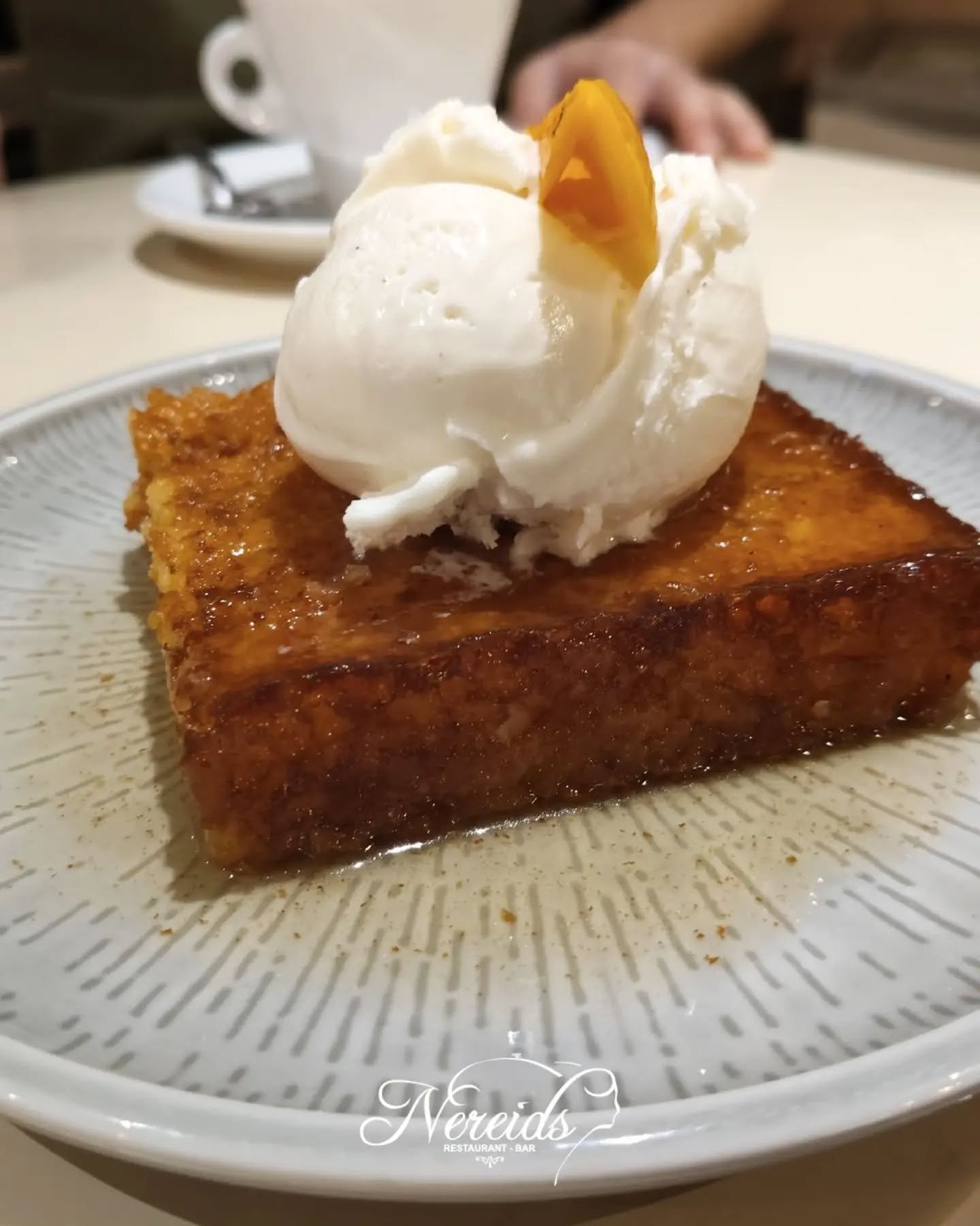 🍊 Our traditional phyllo orange cake, golden and fragrant, served with a scoop of vanilla ice cream. 
The sweetest way to finish your evening!

📍Paleokastritsa, Corfu
Reservations⤵️ https://nereids.restaurant/reservations

#nereidsrestaurantandbar 