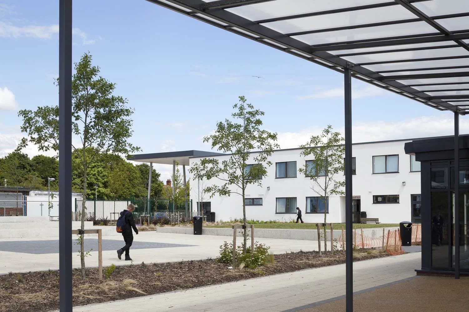 view across the playground back twards the main entrance and elevated canopy