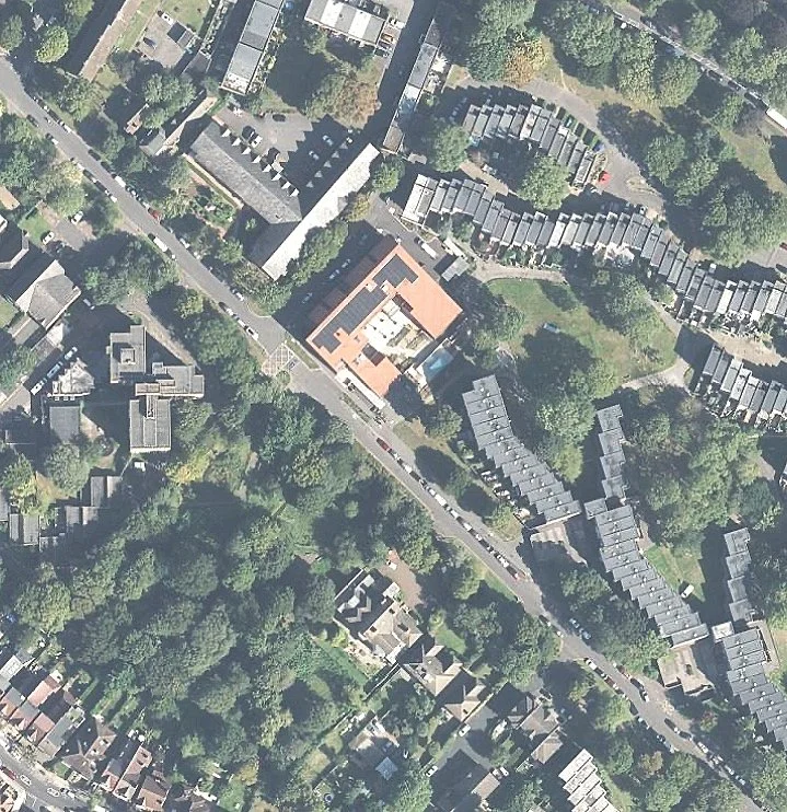 Crescent shaped in plan, the building sits within its suburban context and surrounded by parkland and mature gardens and landscape