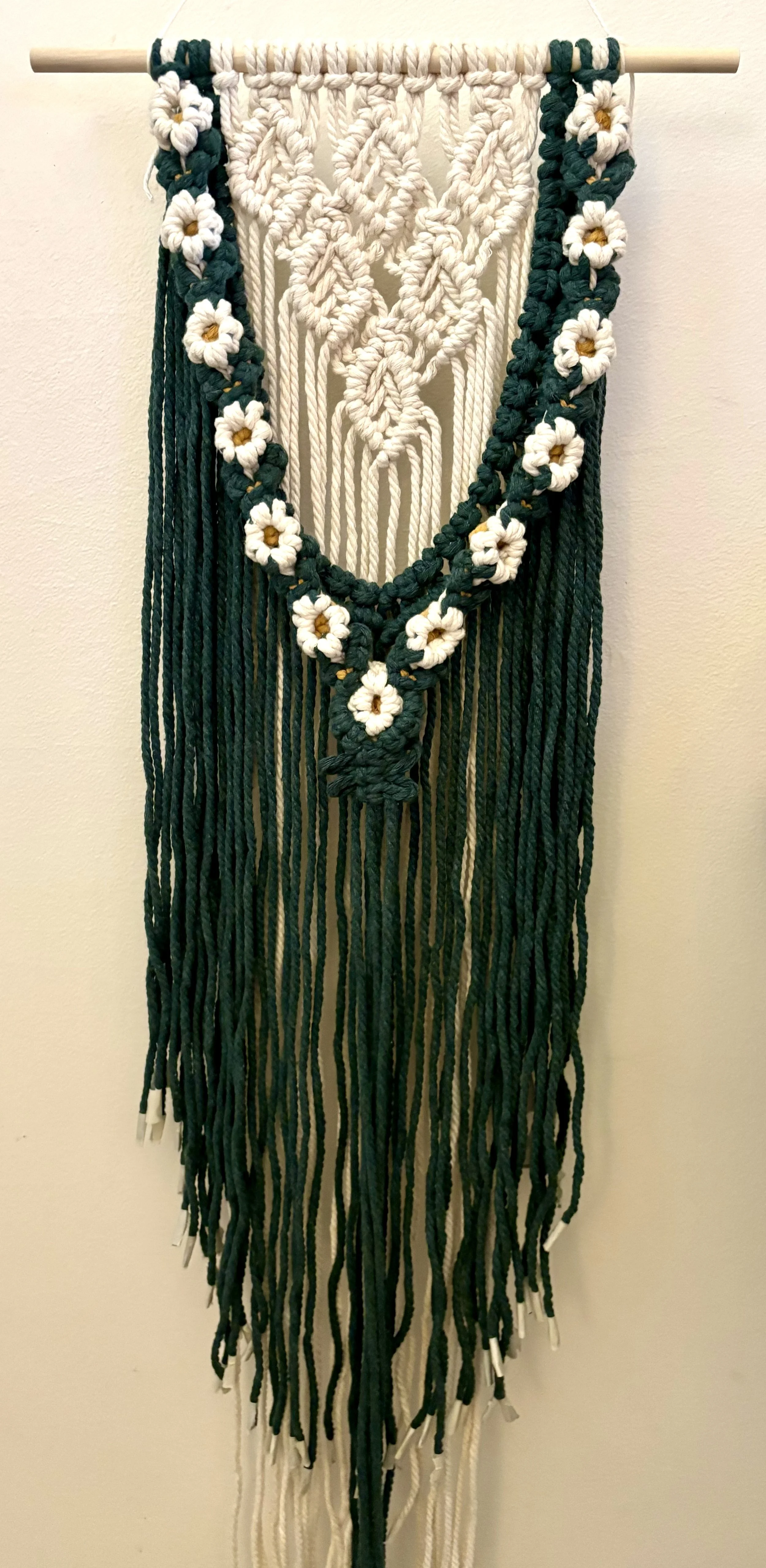 Daisy Chain Wall Hanging, 2025, cotton rope and wooden dowel. 