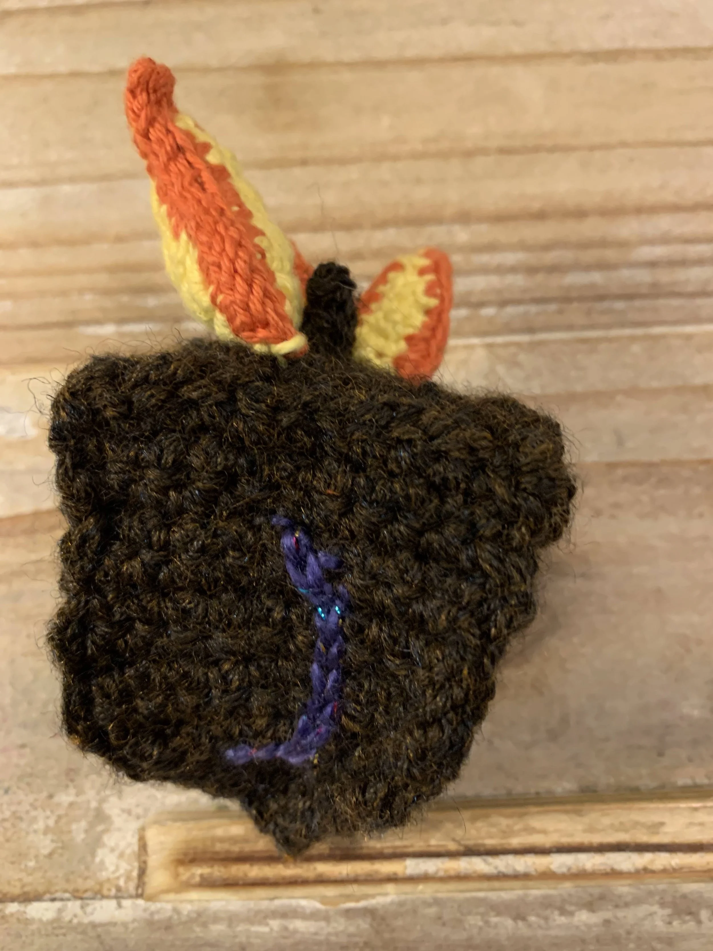 Dreidel of Fire Cat Toy, 2024, original pattern crocheted in cotton and acrylic.