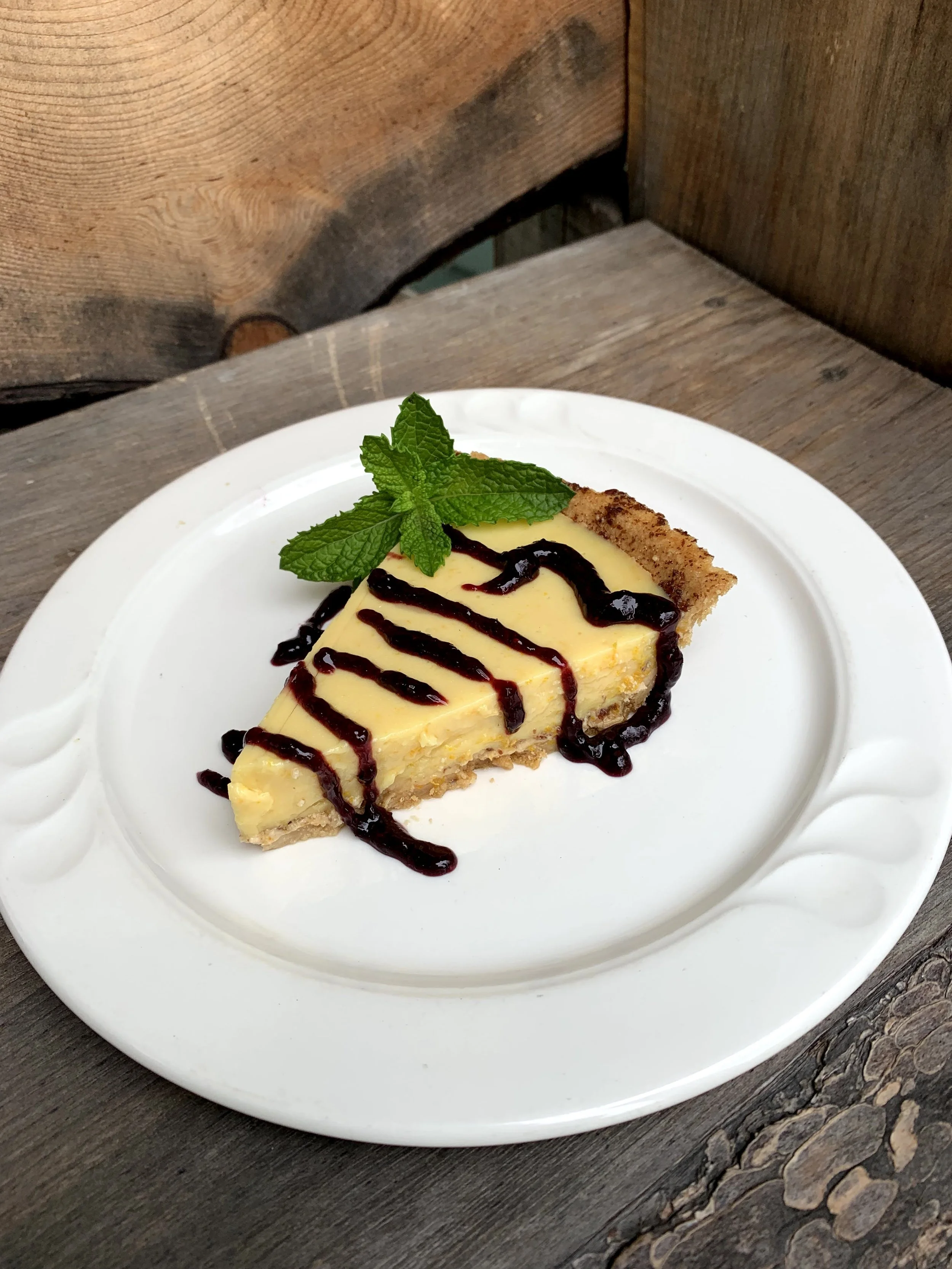 Vegan Citrus Tart with homemade black raspberry sauce