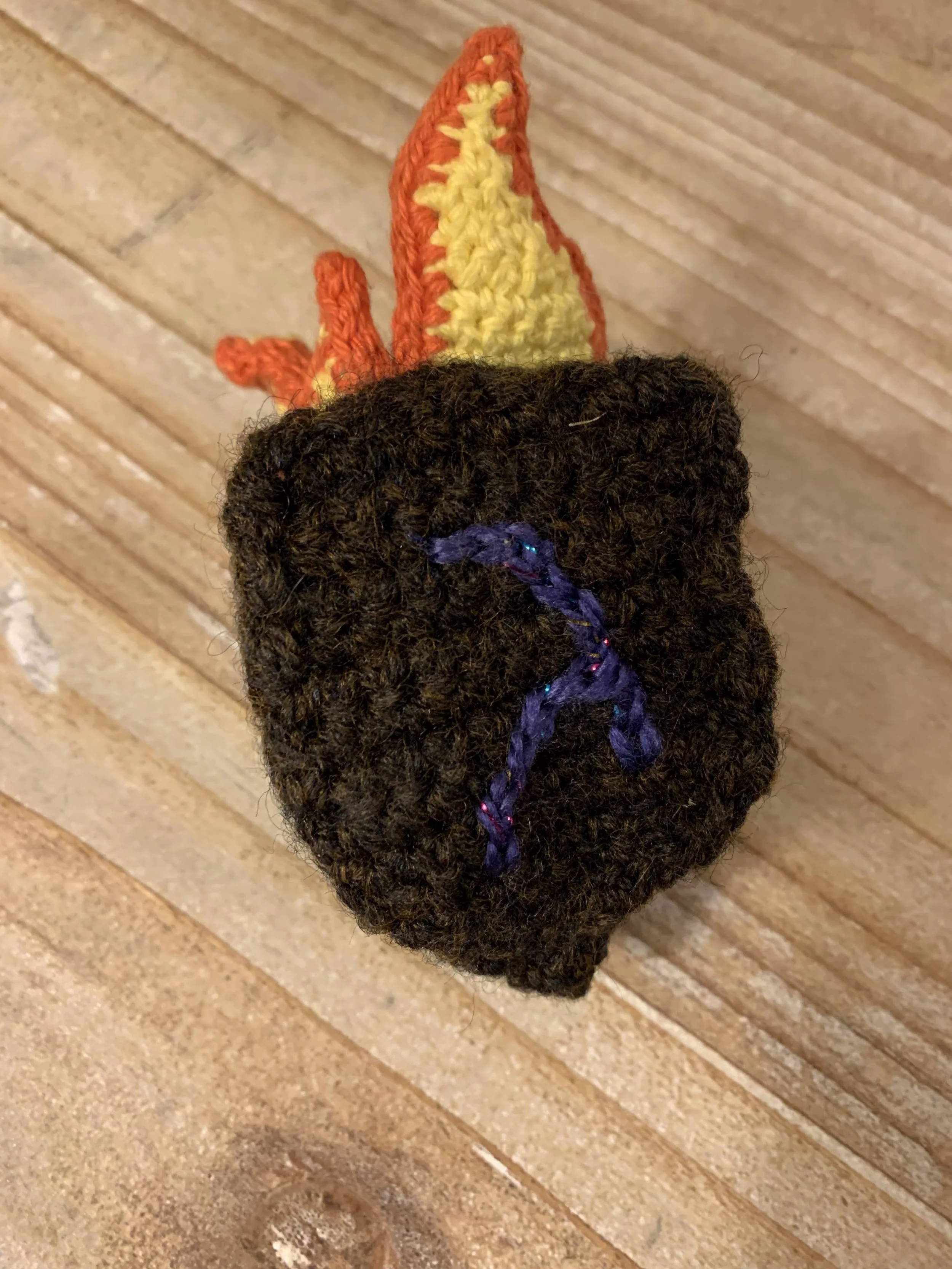 Dreidel of Fire Cat Toy, 2024, original pattern crocheted in cotton and acrylic.