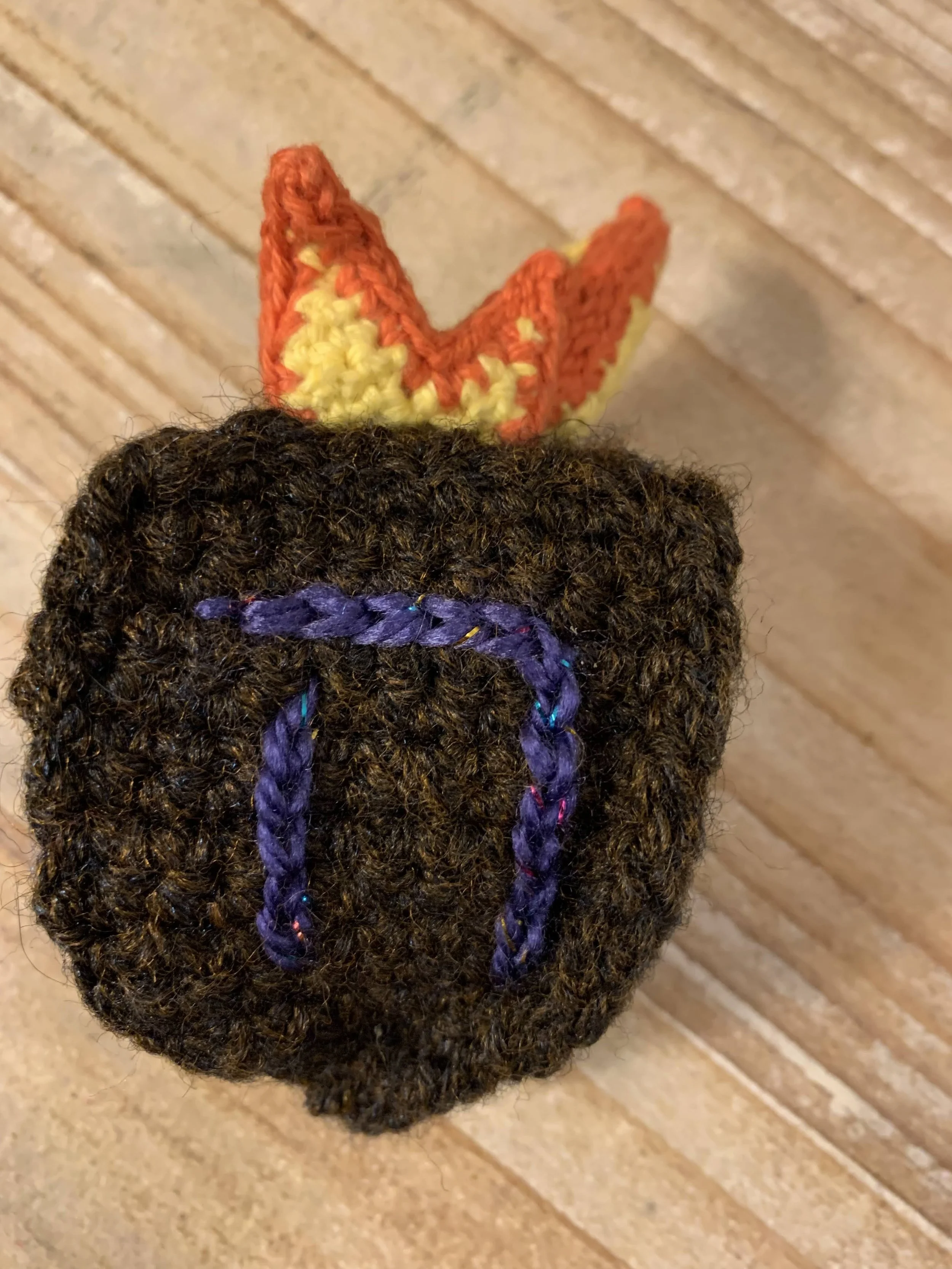 Dreidel of Fire Cat Toy, 2024, original pattern crocheted in cotton and acrylic.