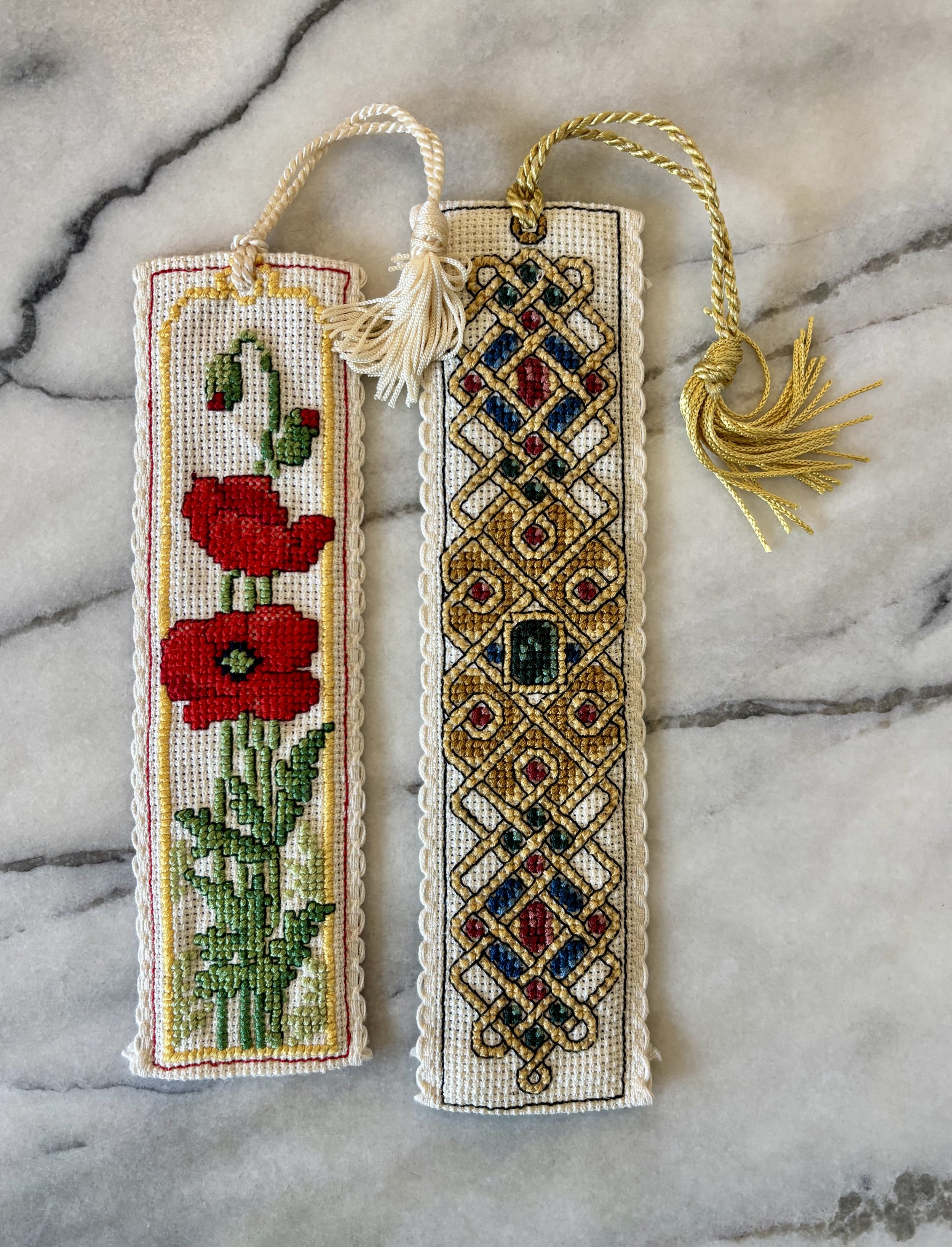 Poppy and Celtic Jewels Bookmarks, 2025, cotton thread on aida with polyester tassel and felt backing.