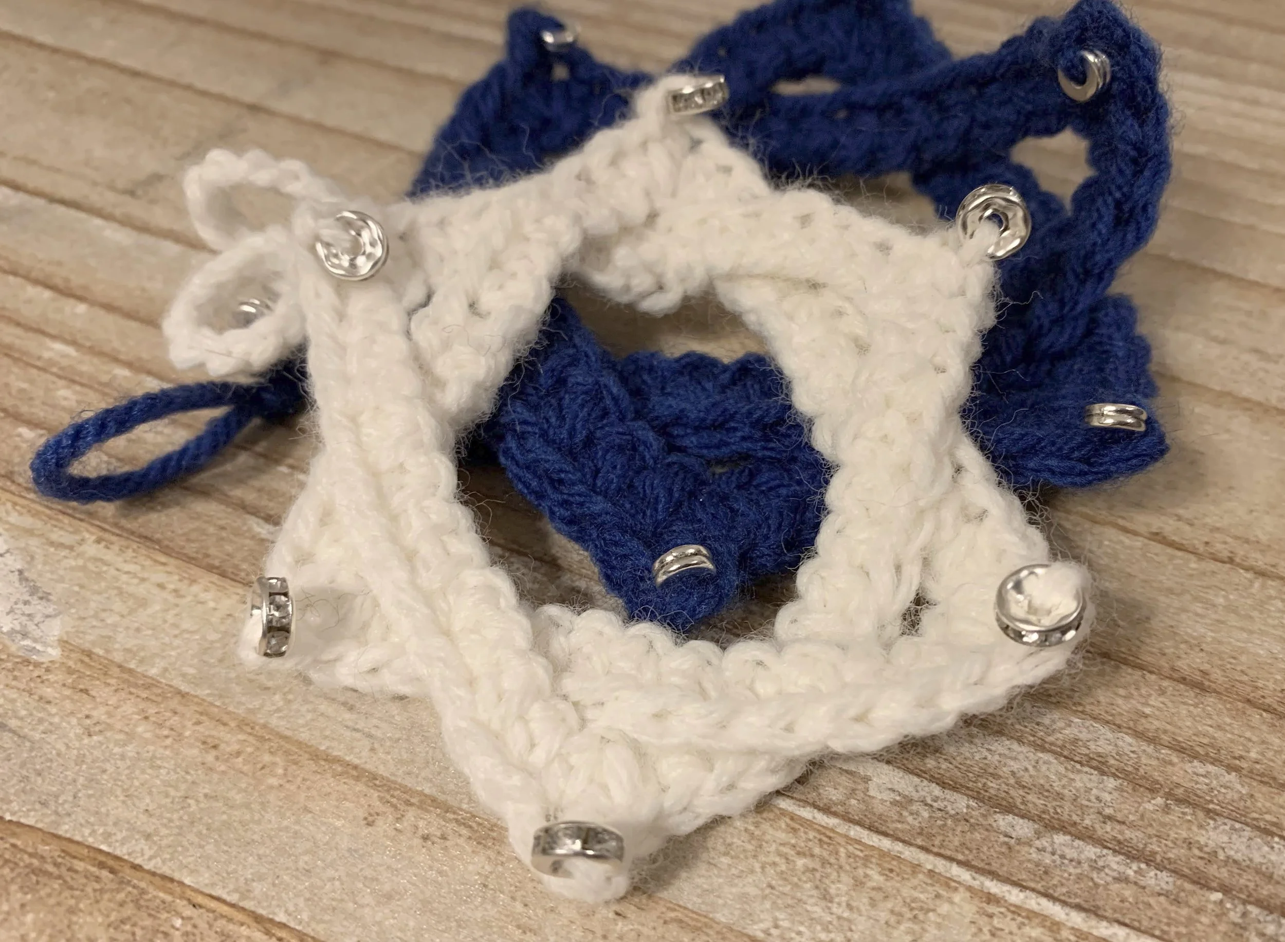 Star of David Ornaments, 2024, crocheted in acrylic.