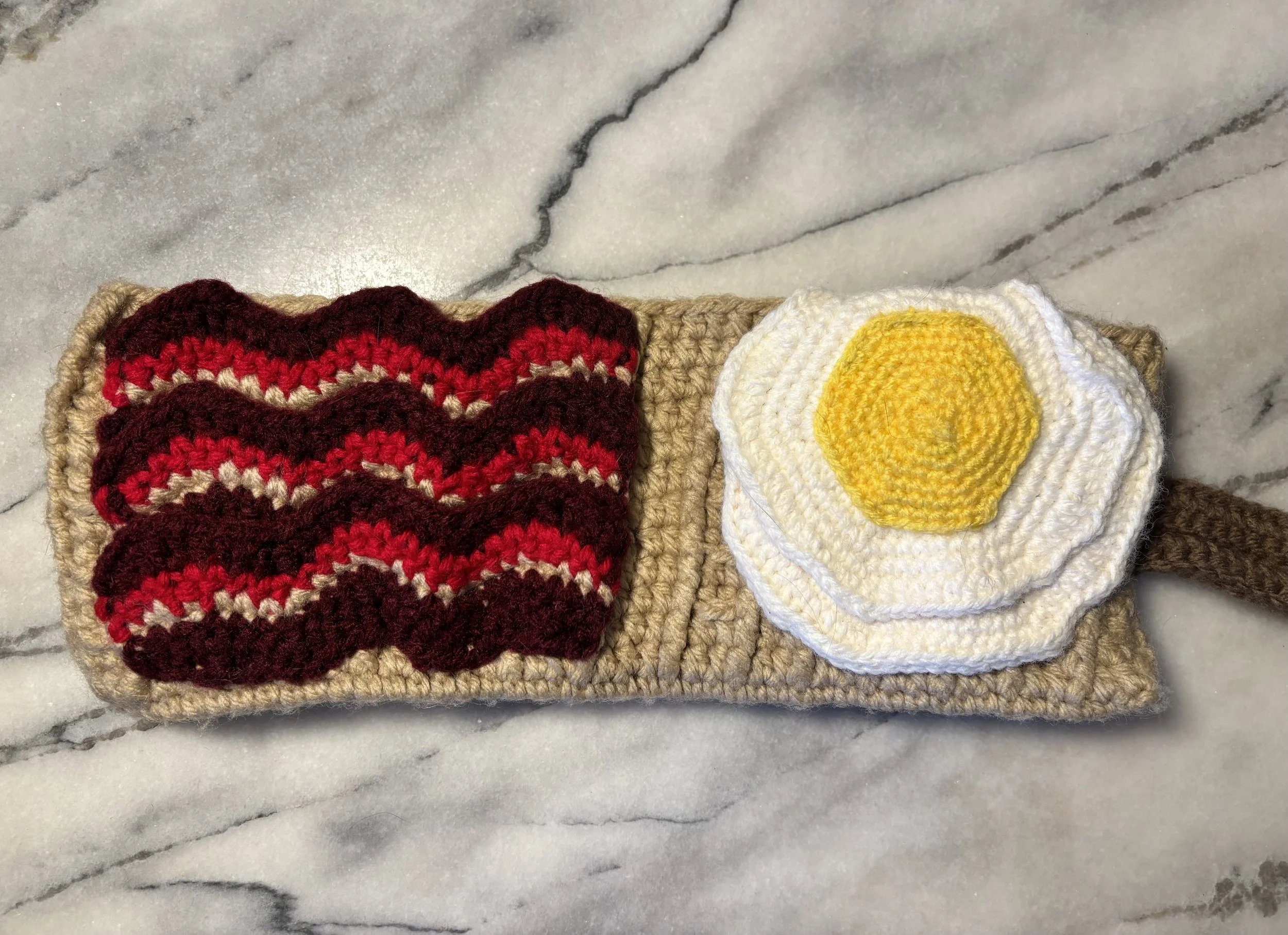 Waffle Wallet, 2024, original pattern crocheted in acrylic.