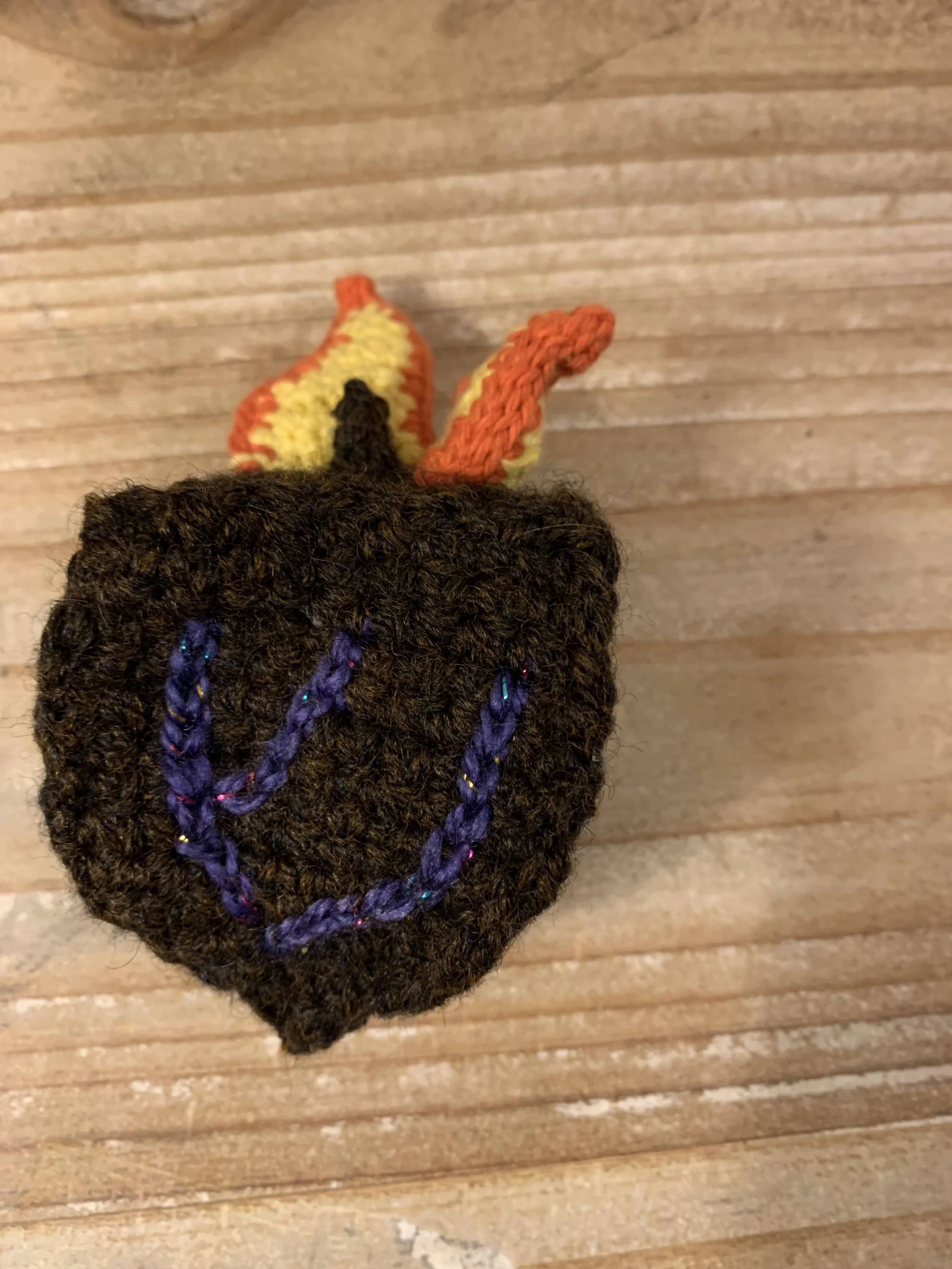 Dreidel of Fire Cat Toy, 2024, original pattern crocheted in cotton and acrylic.