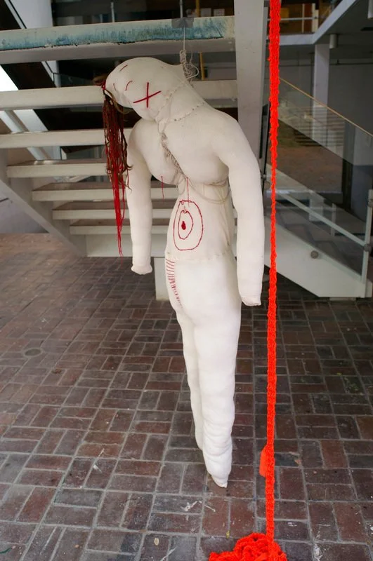 Doll (self-portrait), 2008, cotton, wire, thread, hair; Orange (color study), 2008, knit plastic landscaping tape