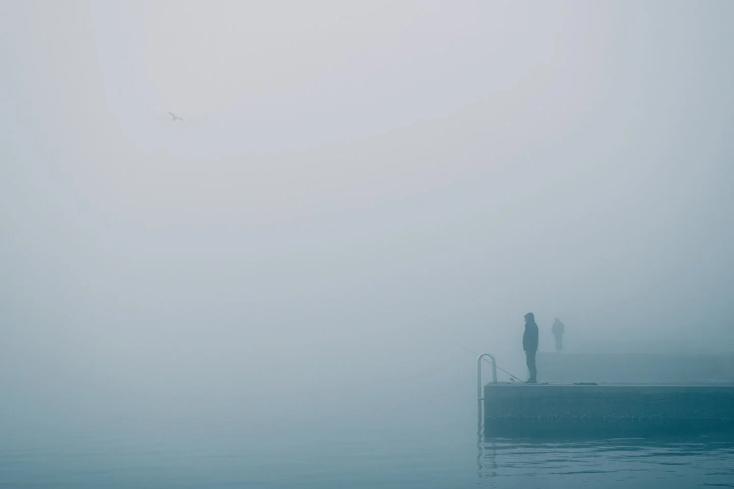 Lost in the silence of the sea 🌫️

Two fishermen standing at the edge of the pier in the heart of Piran, wrapped in thick afternoon fog. 🔹

Stripped of color and detail, the scene turns into pure minimalism &mdash; silhouettes, stillness, and negat