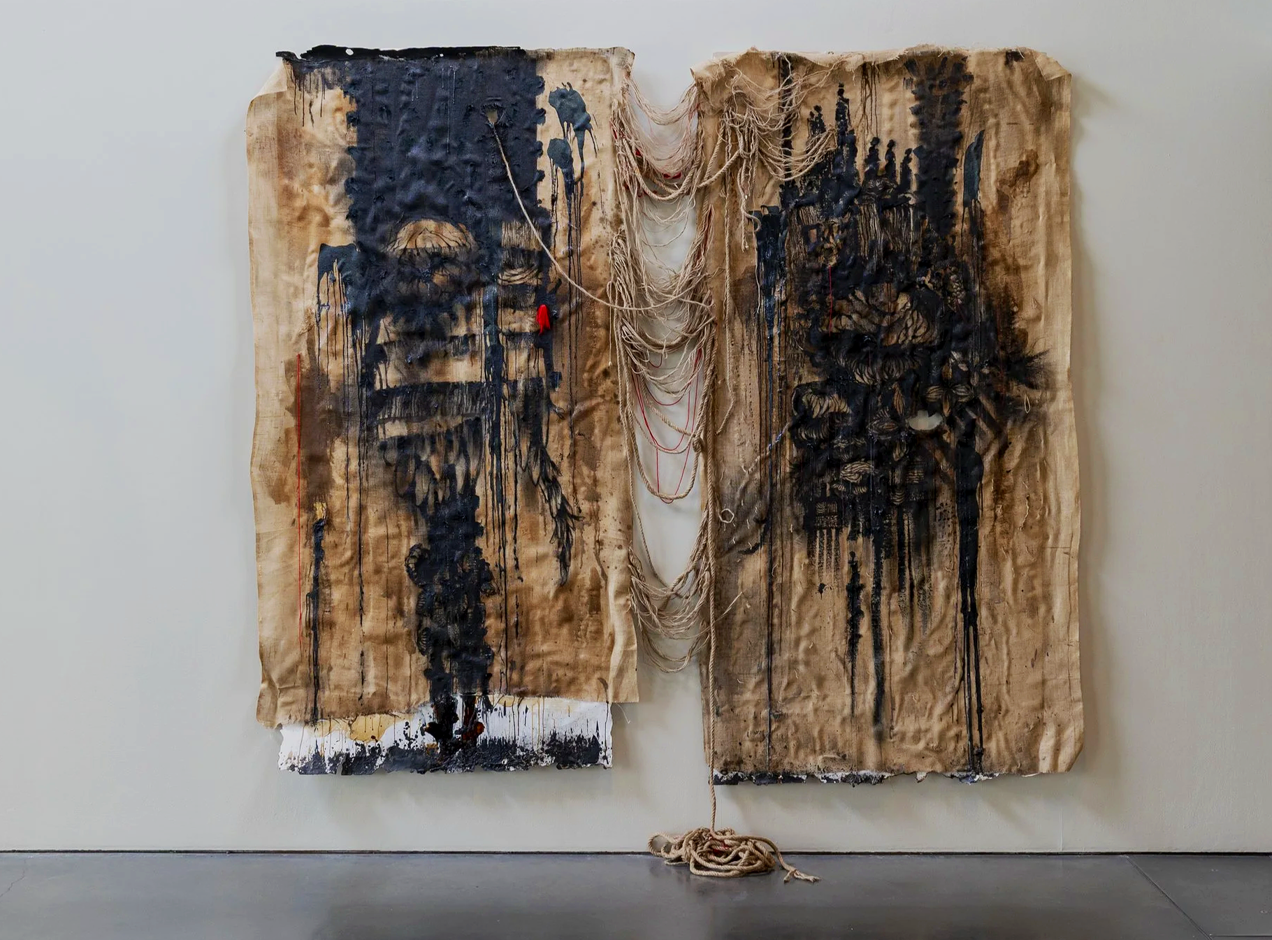 Body Leave to Enter,  Body Leave to Remain. 2026
Beeswax, Coffee, Clay, Thead and Charcoal on Bulp Sack
520cm x 300cm