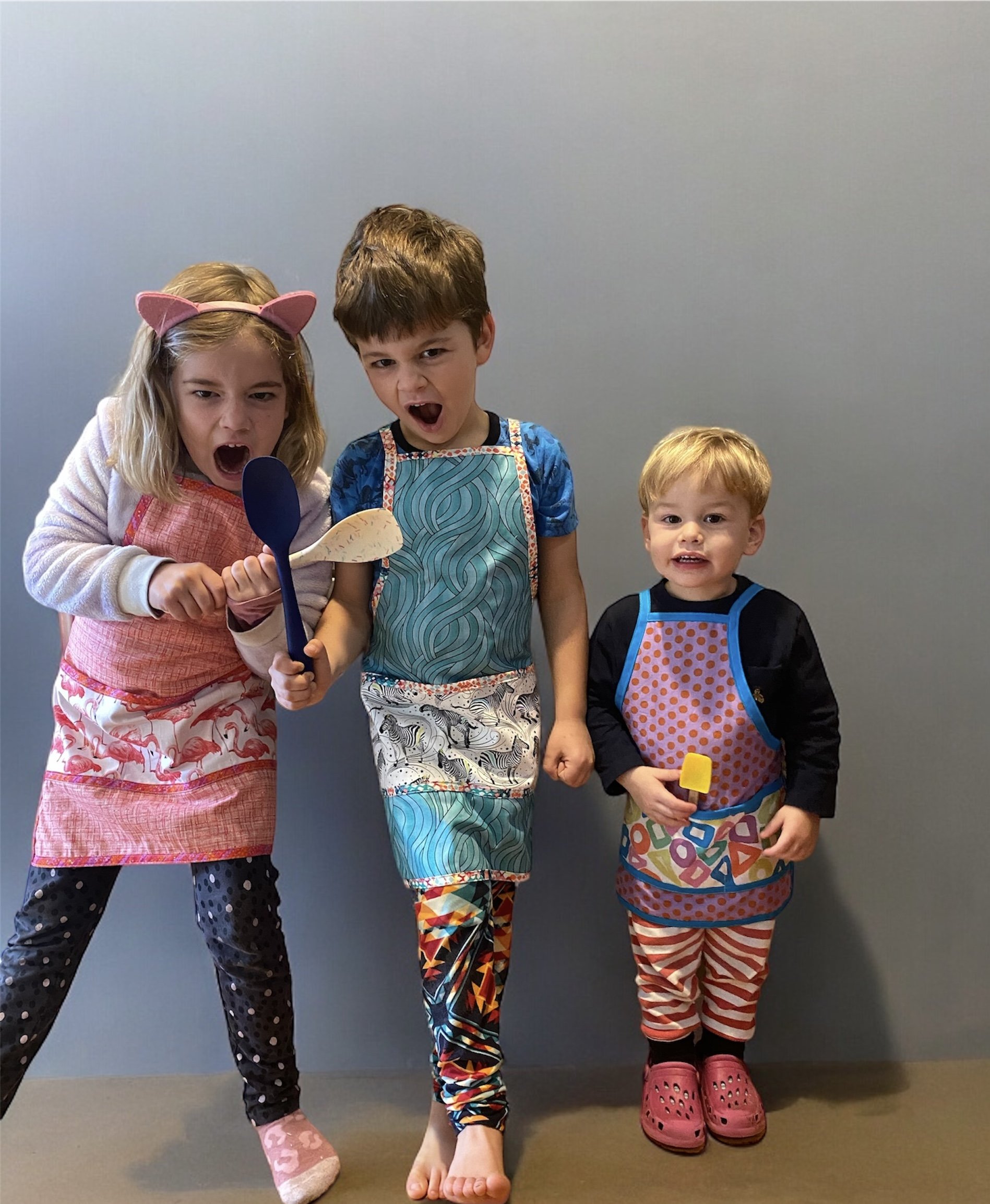 These three modeling aprons that were ordered as a Christmas gift for grandkids so they can look good while baking with their grandma. She told me a little bit about what each girl likes and I took it from there.