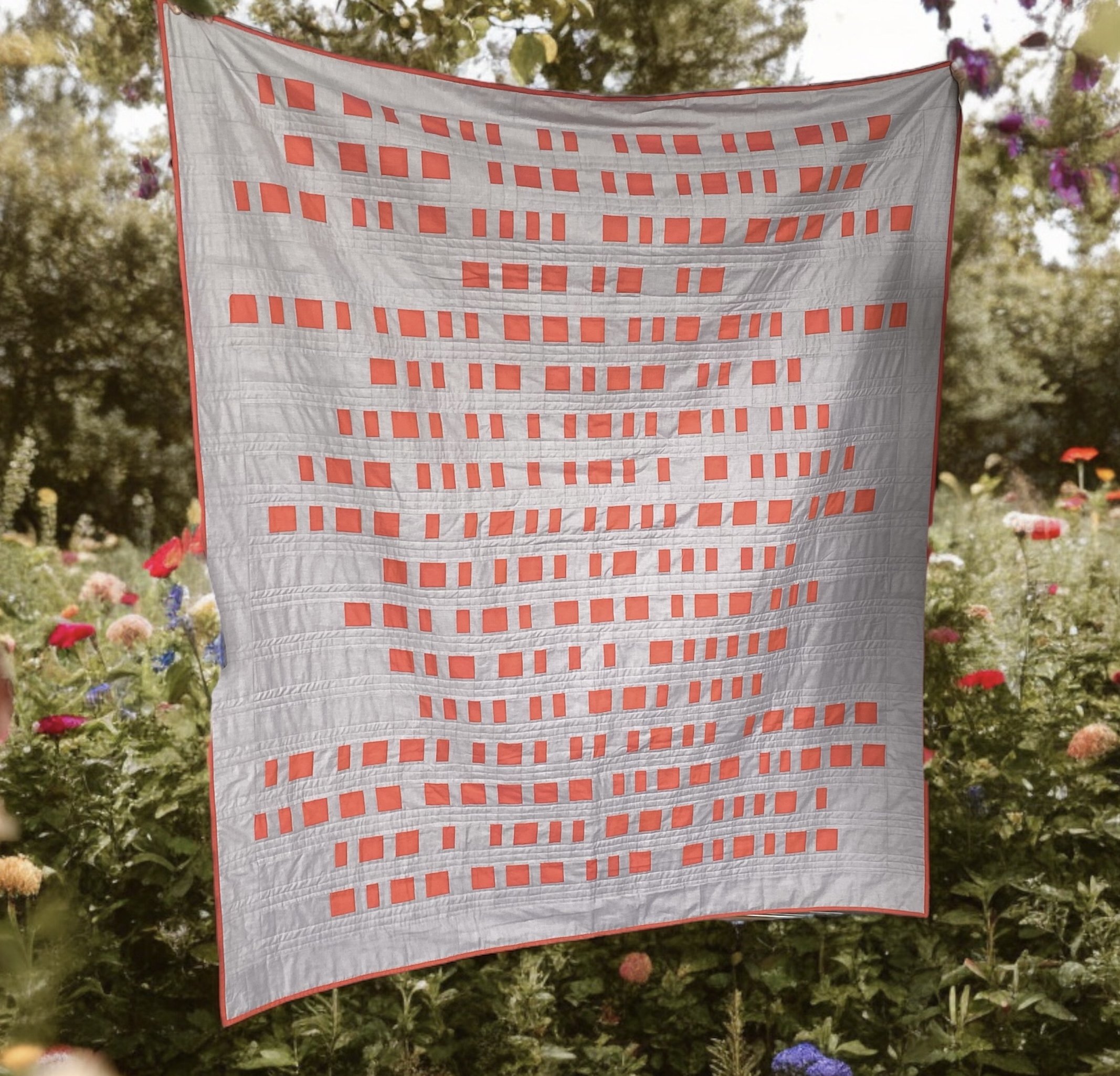 This wedding gift quilt may look like a bunch of squares, but it's morse code. The bride enjoys morse code and the quilt is a lyric from the song they did their first dance to.