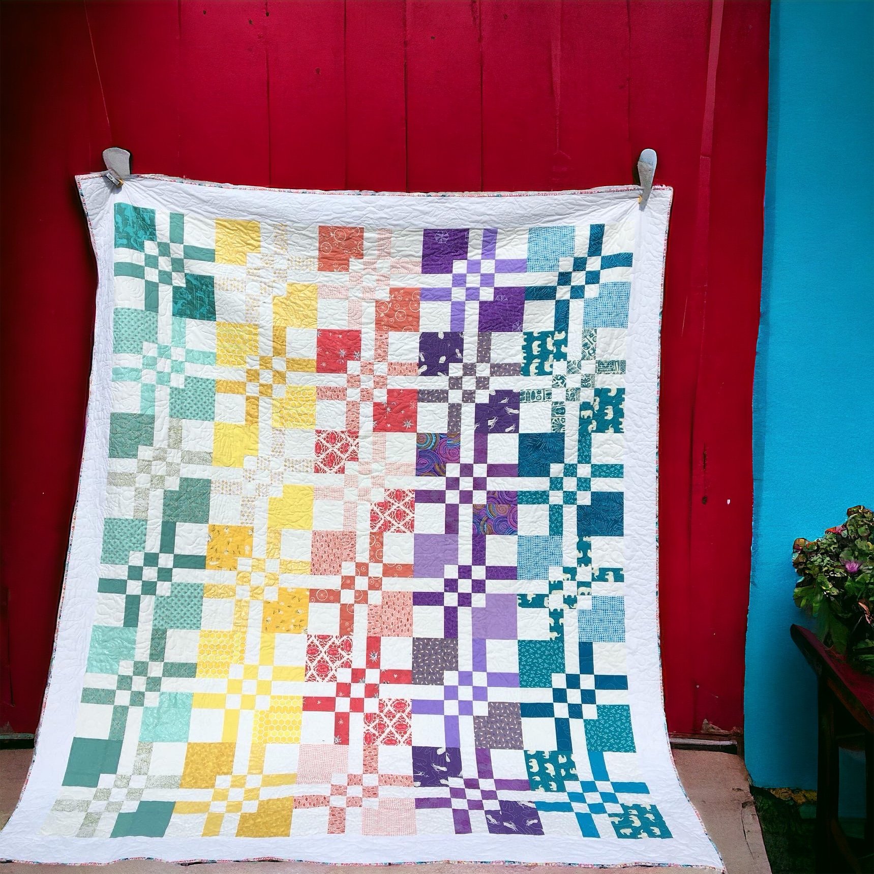 A queen size bed quilt for an OBX beach cottage (pattern is Cat's Cradle from "Charm School")