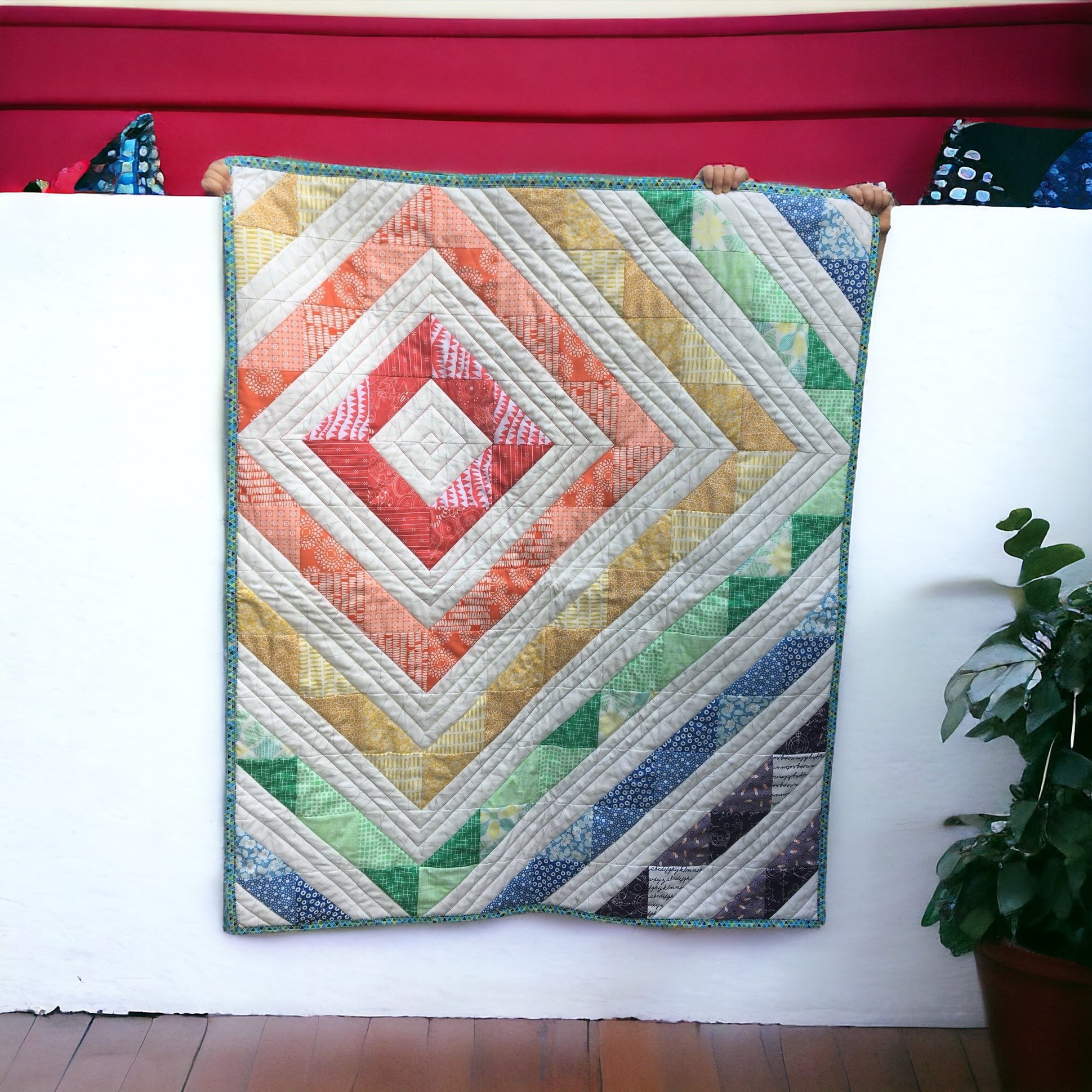 This rainbow diamond baby quilt was made for a gender surprise baby.