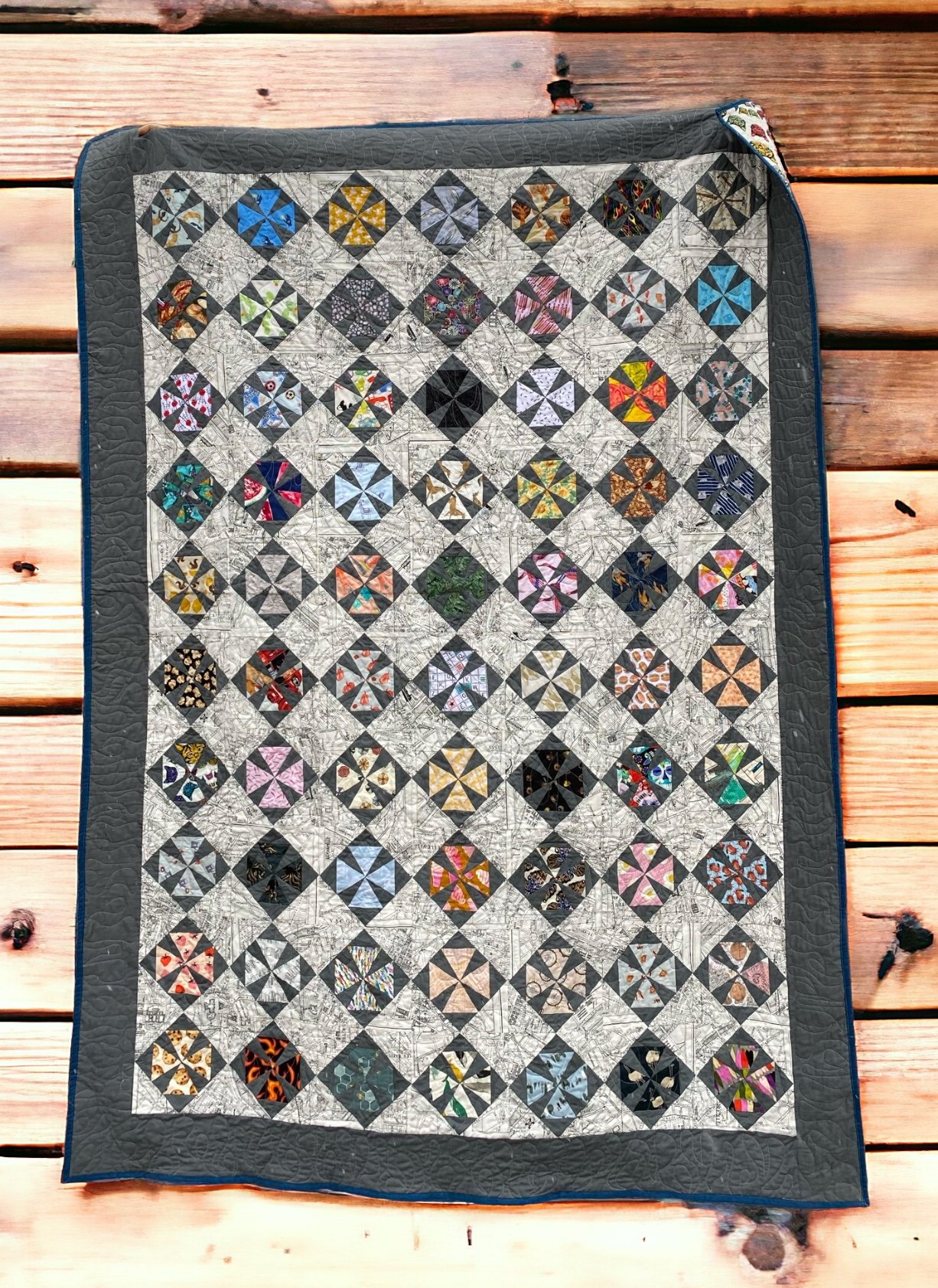 This is a Maltese Cross block repeated, each with a different fabric representing a different memory, for my husband's bed at the fire station.