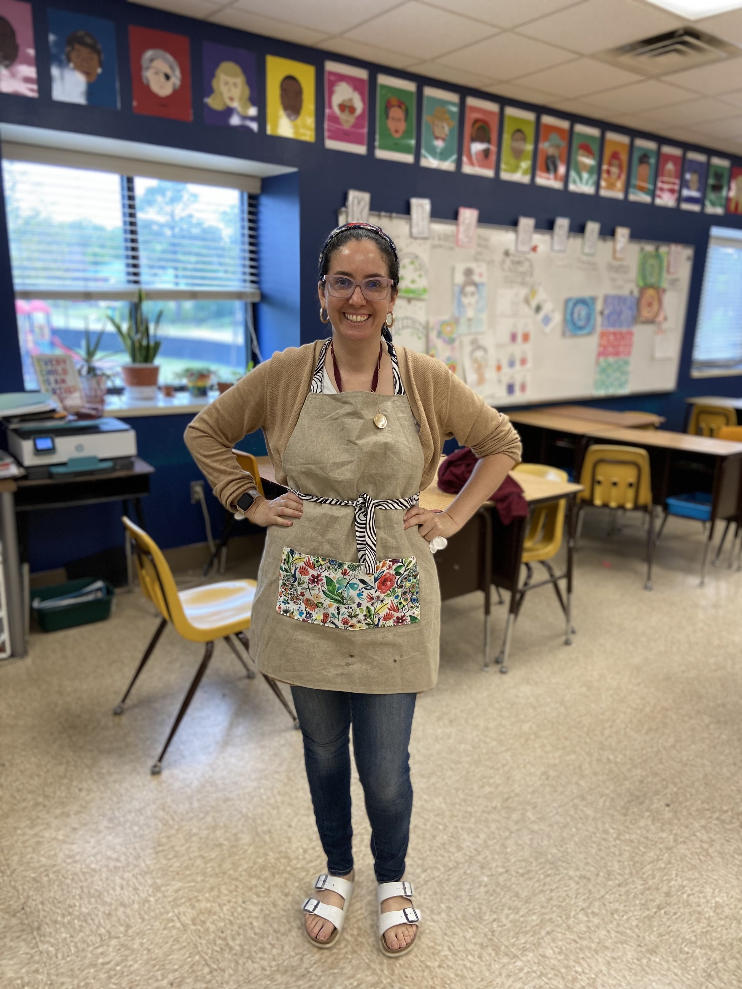 Mimi's art teacher apron customized with a compartmented pocket for tools and supplies