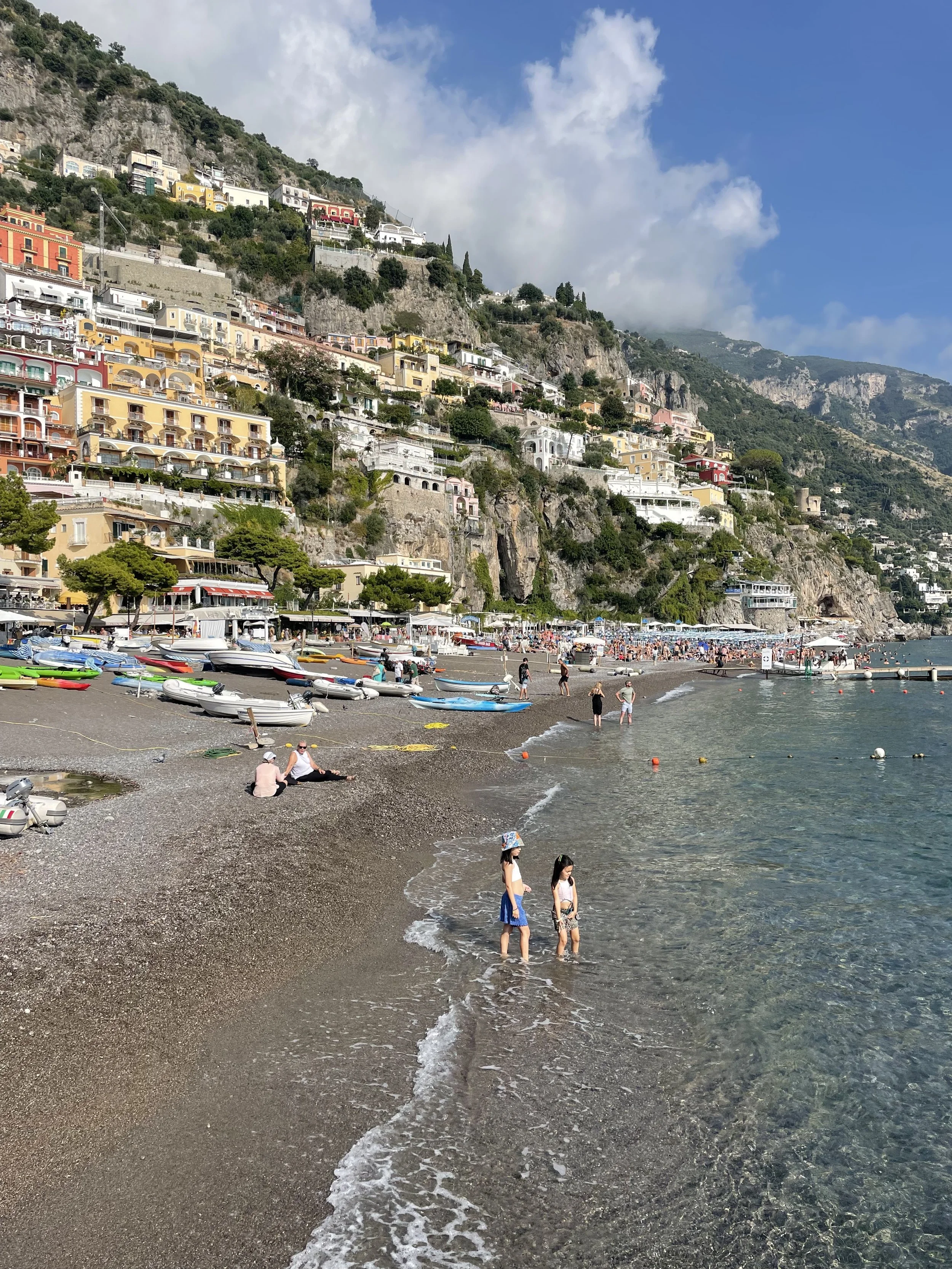 Beautiful beach in Positano, Italy with Colorful building going up the coastline