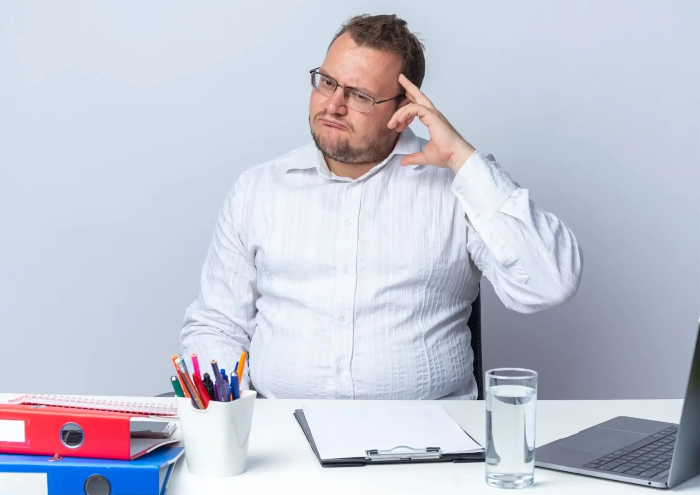 A man thinking if he has ADHD - Asha Coaching & Consulting