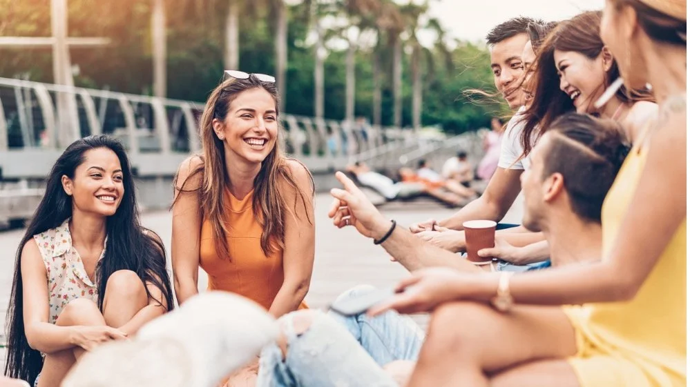 group of couples laughing feeling connected with their partners and their friends- trauma therapy for relationship patterns in Owing Mill, MD