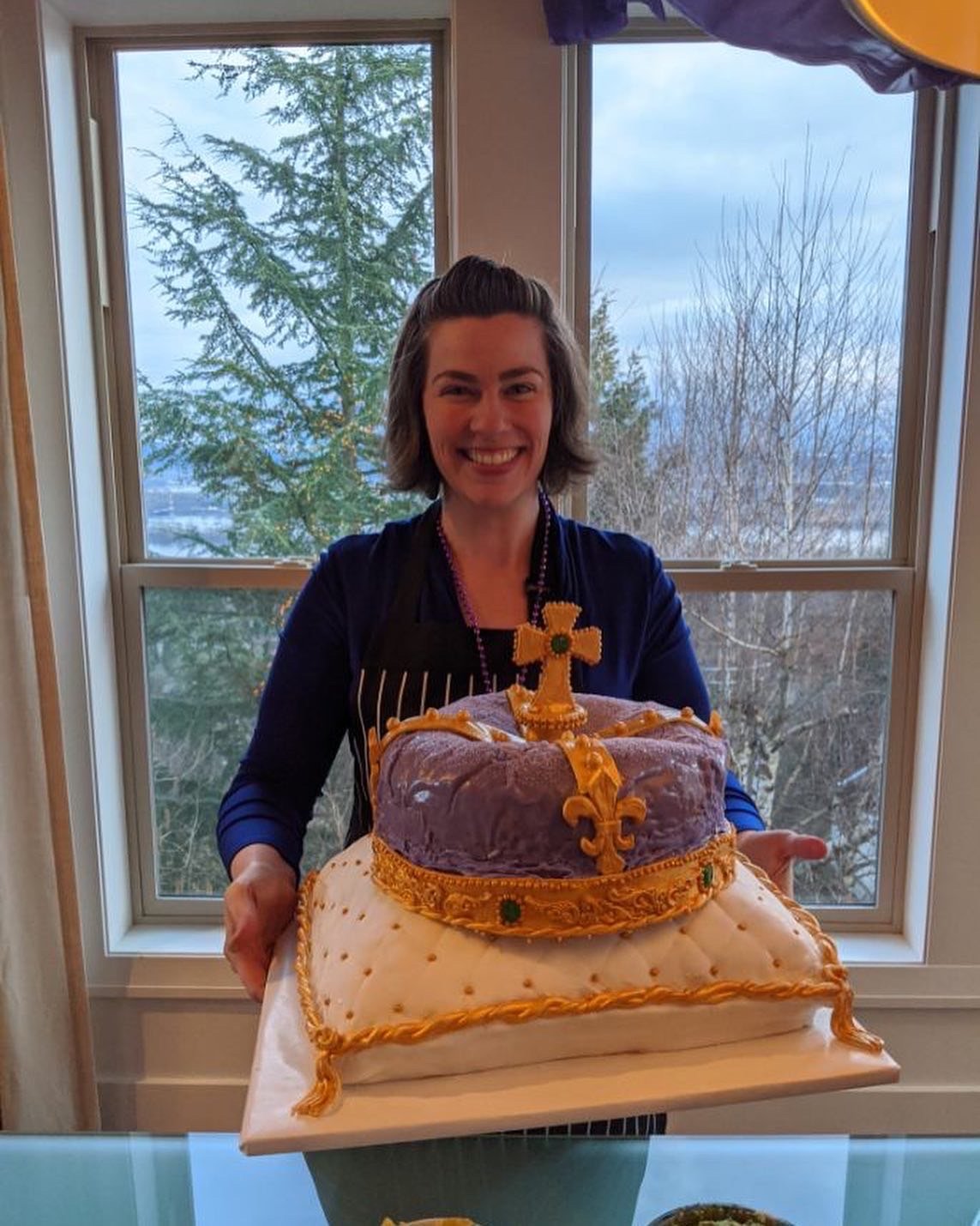 One of my fancy bakes! A mardi gras king cake in the shape of a royal crown on a fluffy pillow. 99.9% edible!