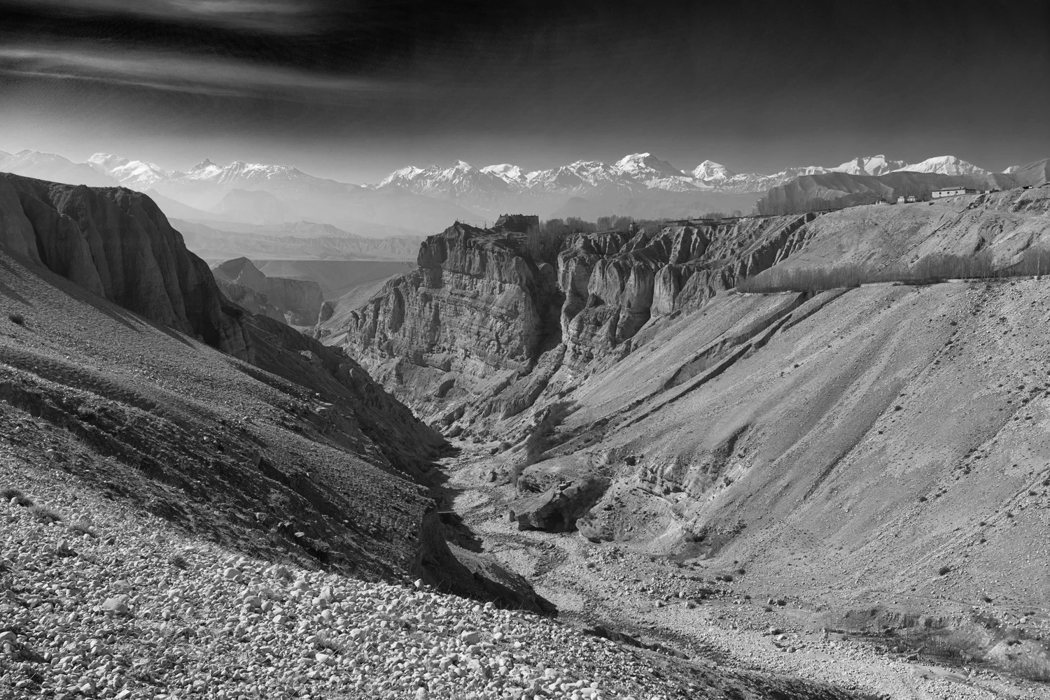Canyon leading to snow-capped peaks