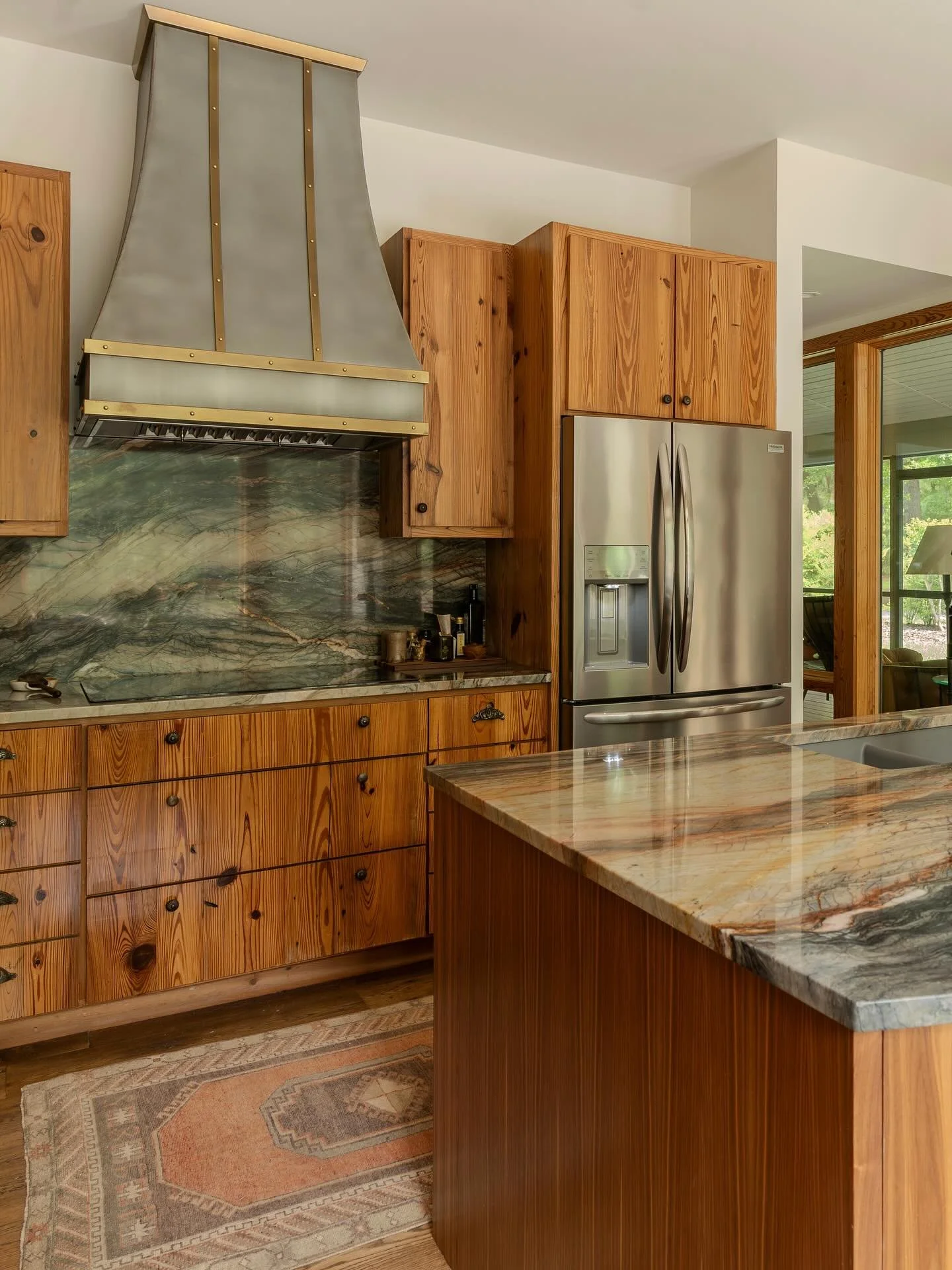 Against the grain. This kitchen transformation features a custom hood by @forsythmetalworks, beautiful new countertops from @agmimports, and a walnut island crafted by @perrin_woodworking.